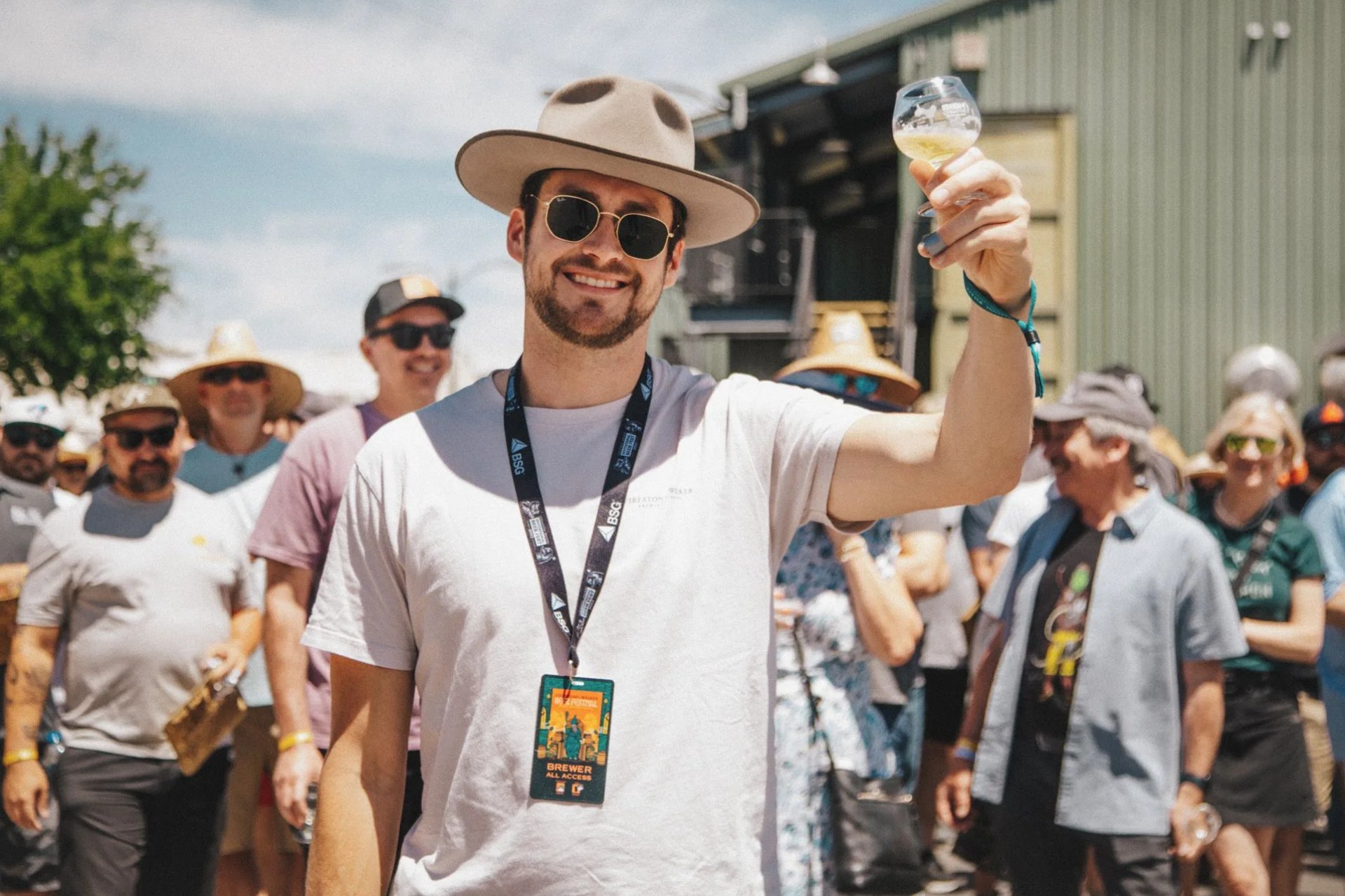 brewer holding a beer at the firestone walker invitational