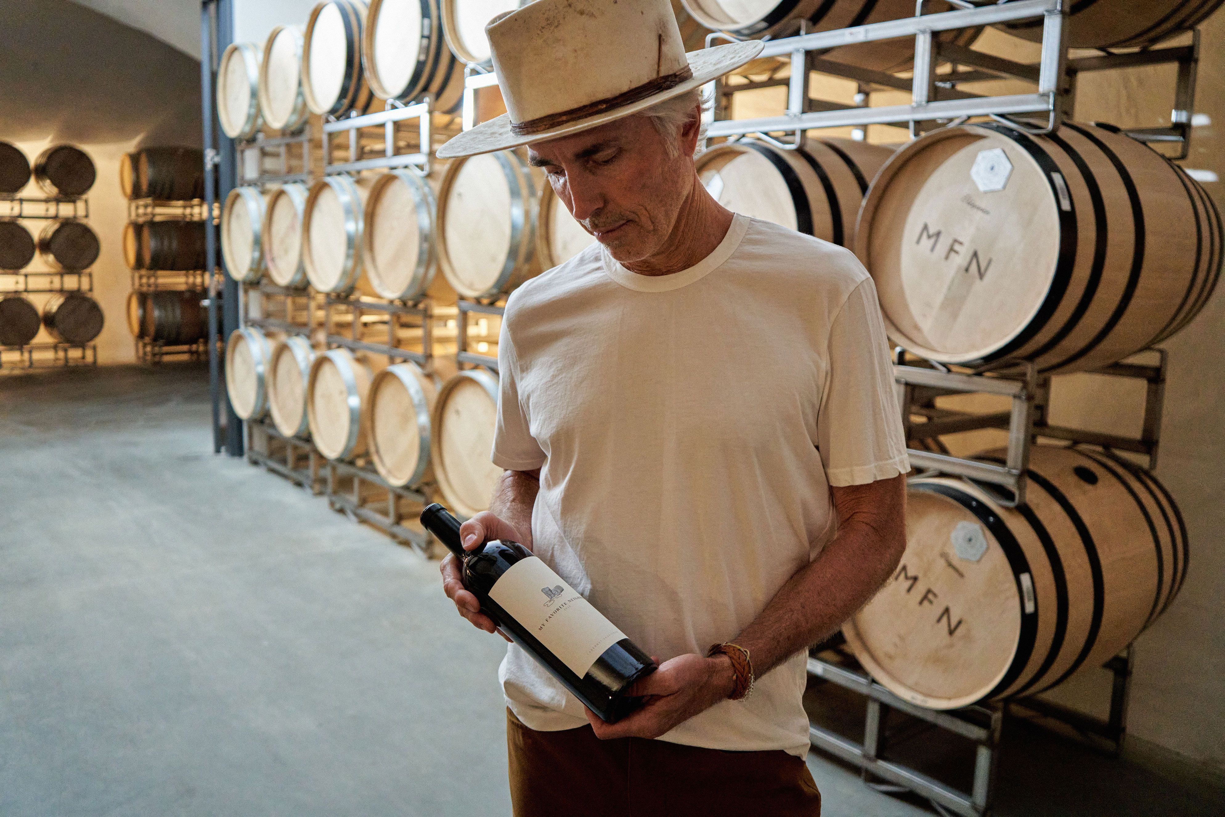 man holding my favorite neighbor cabernet wine bottle