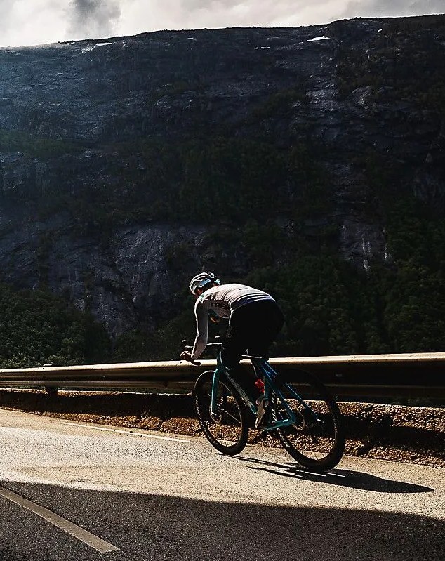 man riding madone bike on road