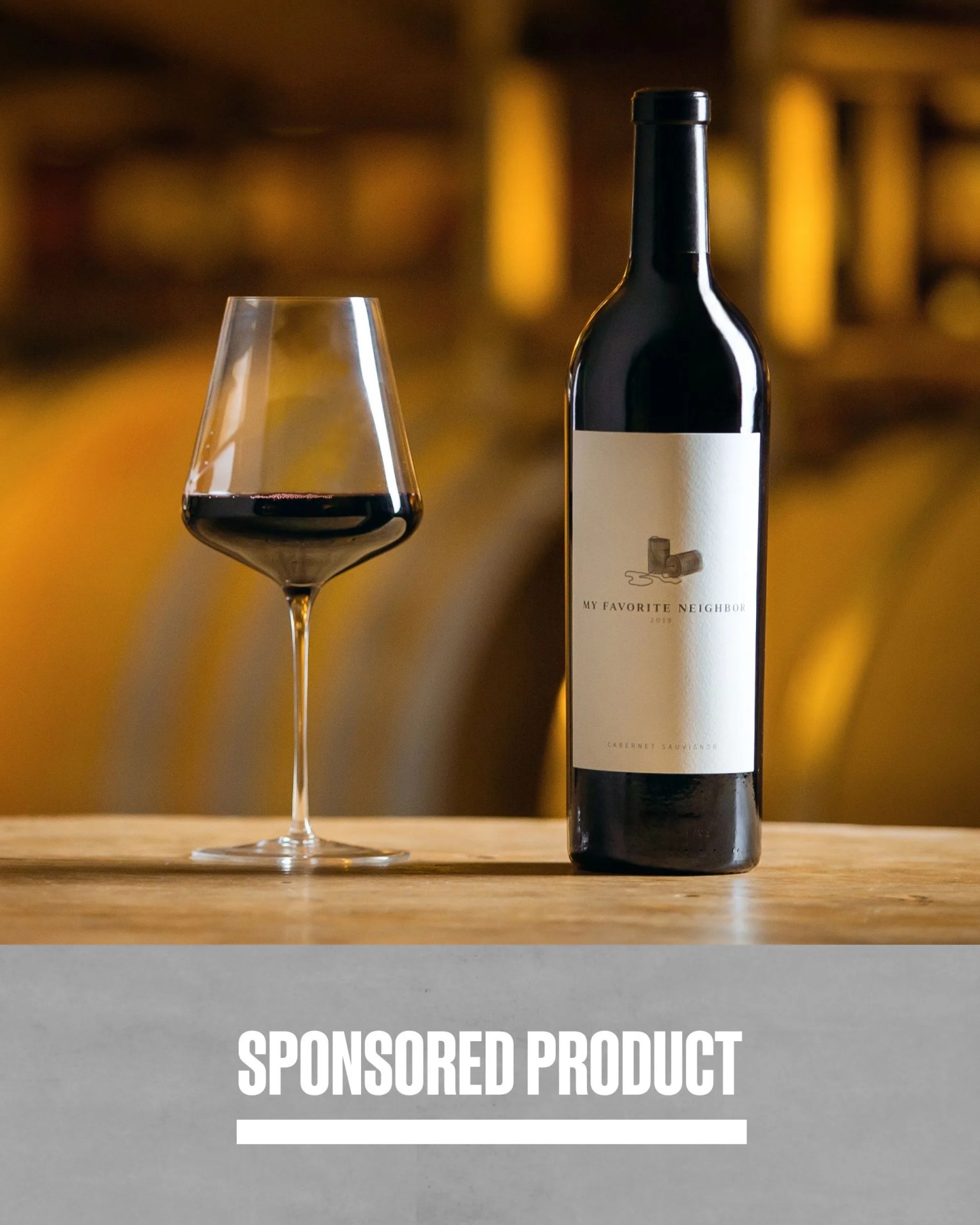 sponsored product my favorite neighbor bottle of cabernet poured out into to a glass