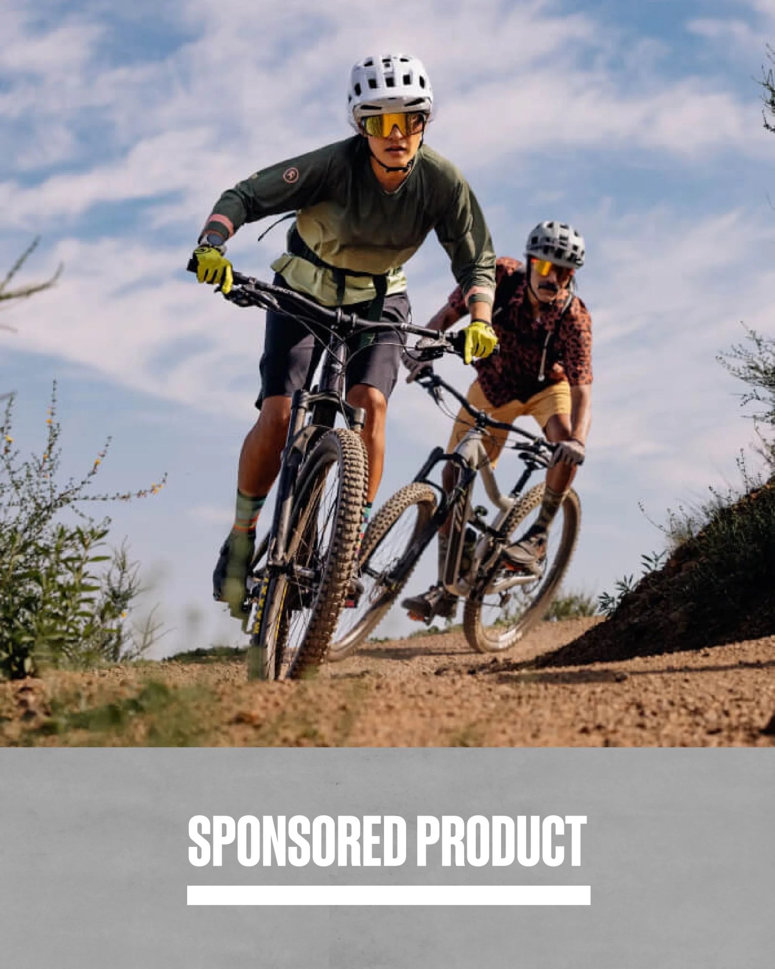 sponsored product two people biking down dirt path wearing backcountry gear