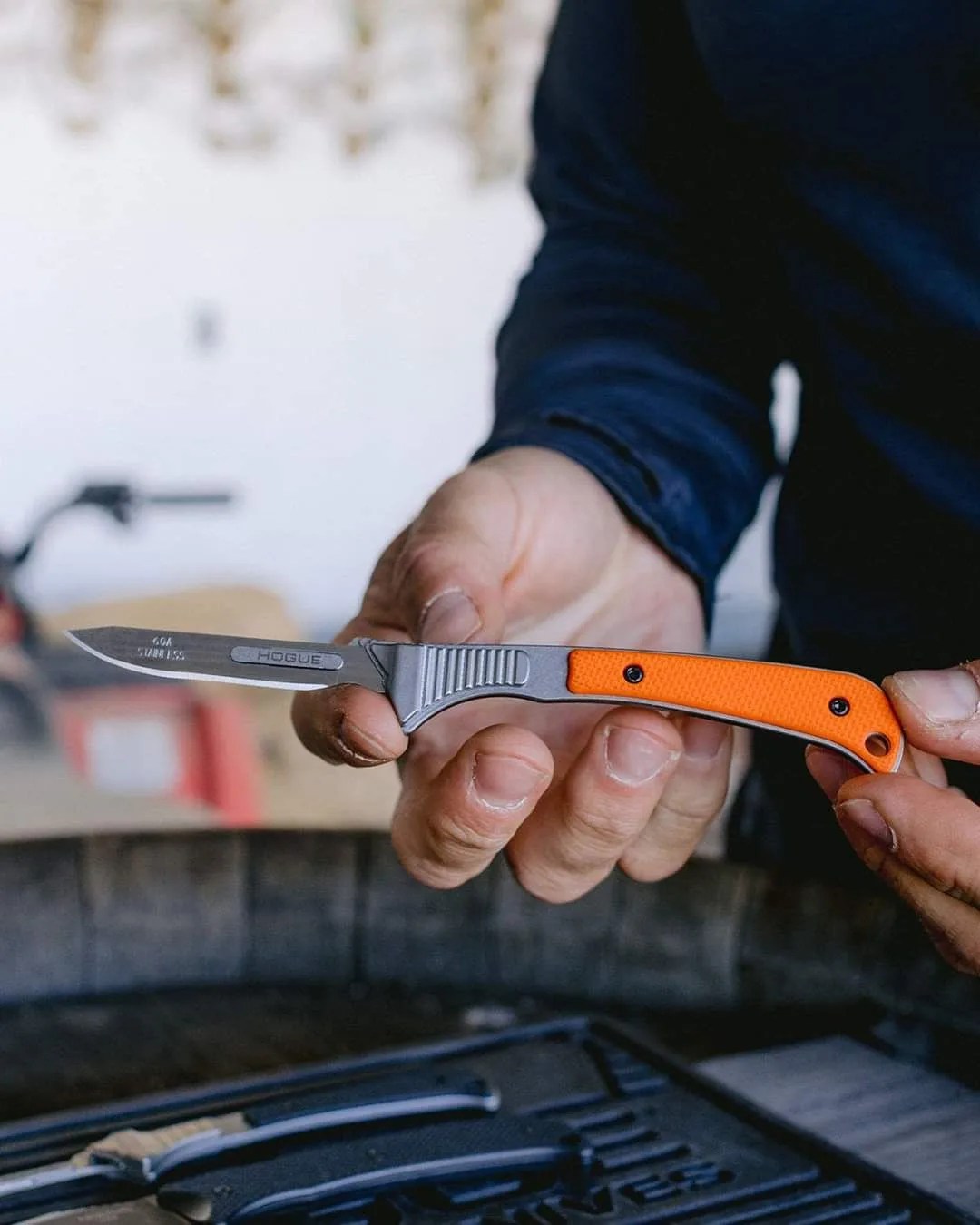 man holding hogue expel scalpel with havalon replaceable blade
