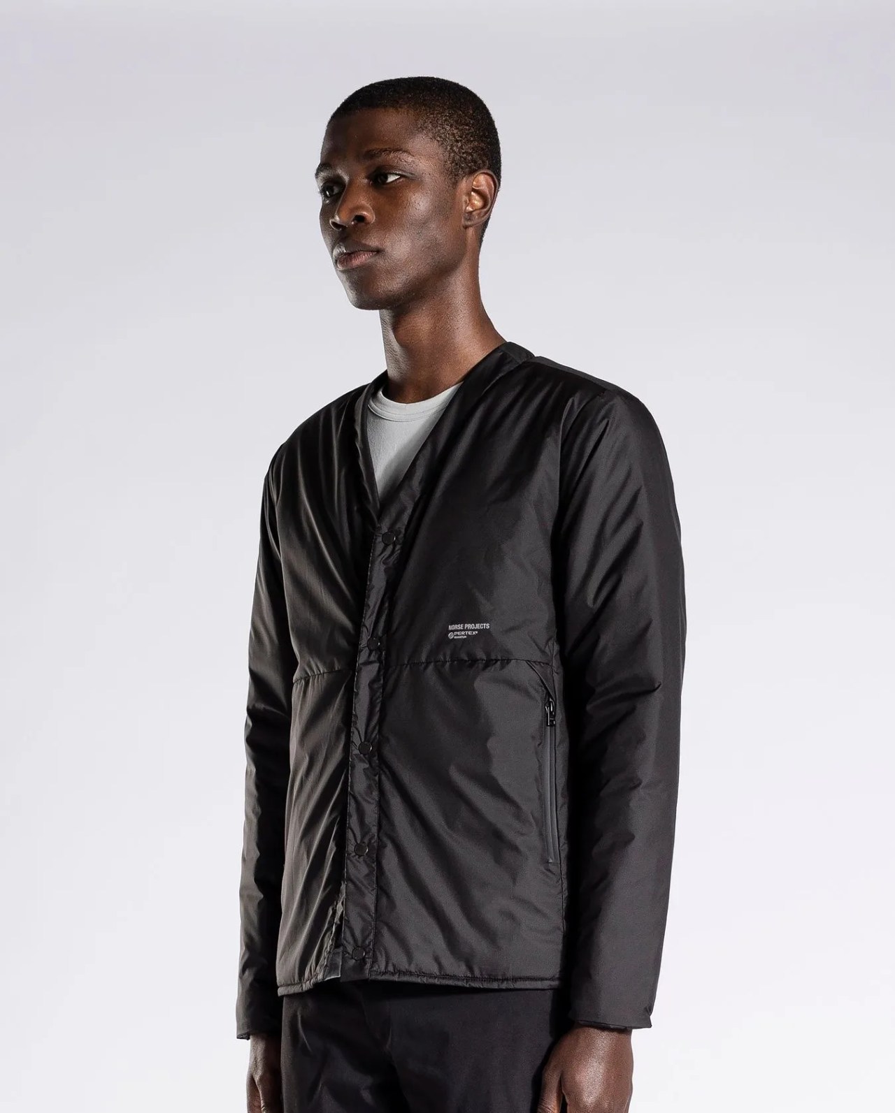 man wearing norse project's otto light pertex jacket