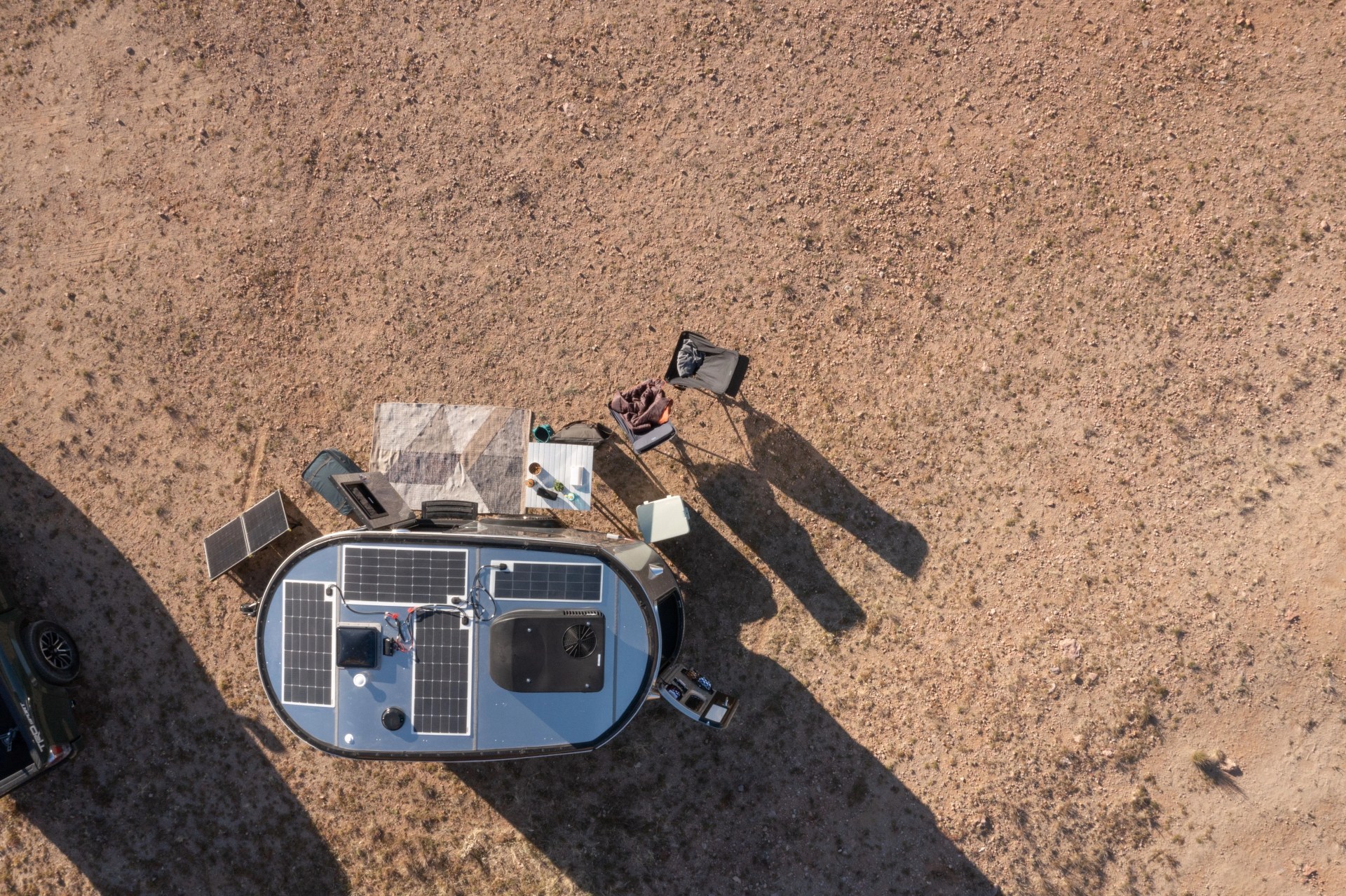 airstream camping trailer shot from above with rooftop solar panels