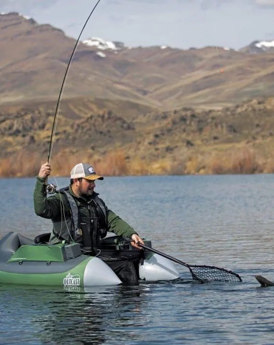 man fishing while sitting in outcast super fat cat float tube