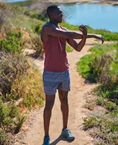 man stretching wearing prana men's activewear