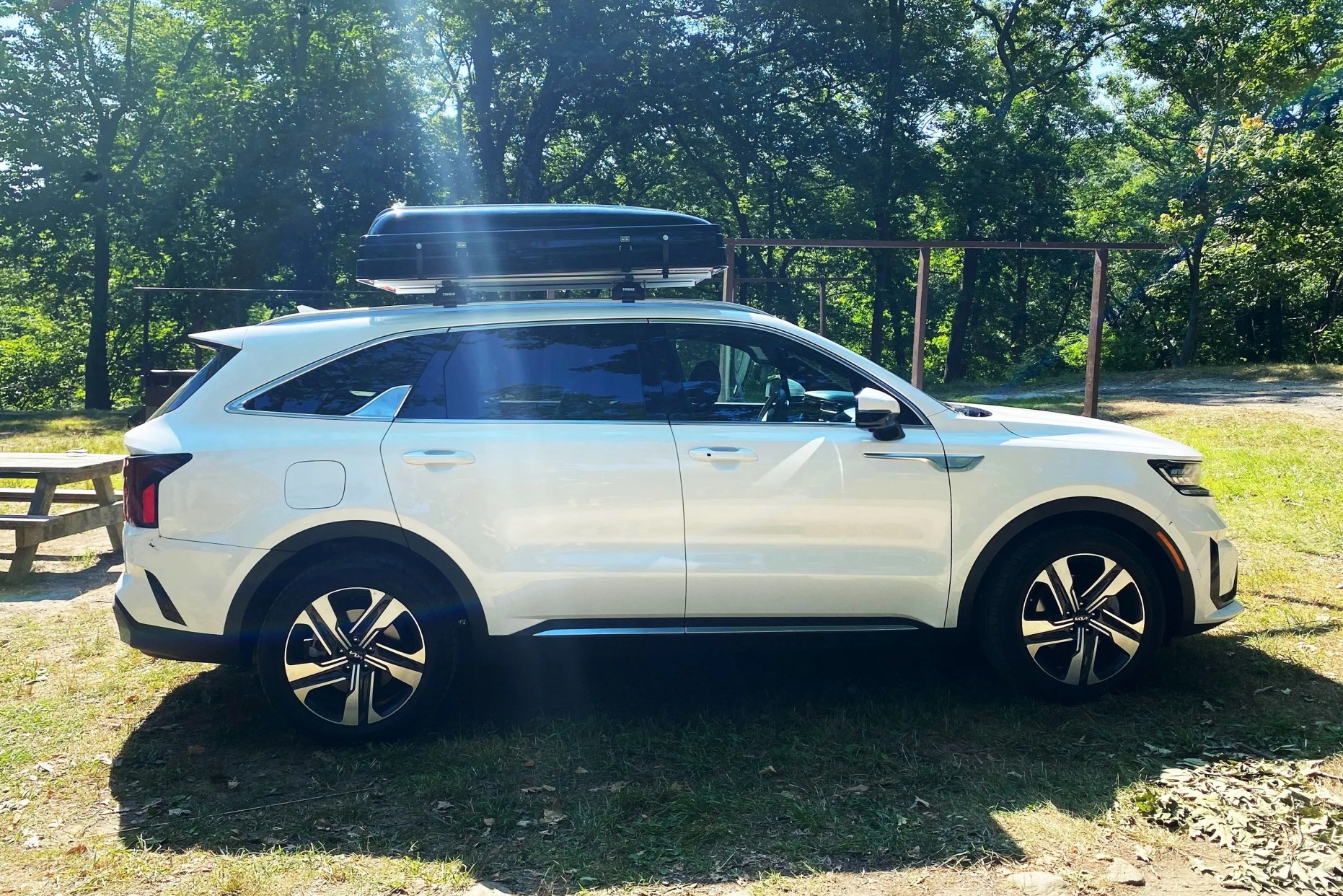 roofnest condor xl tent box on top of a white kia