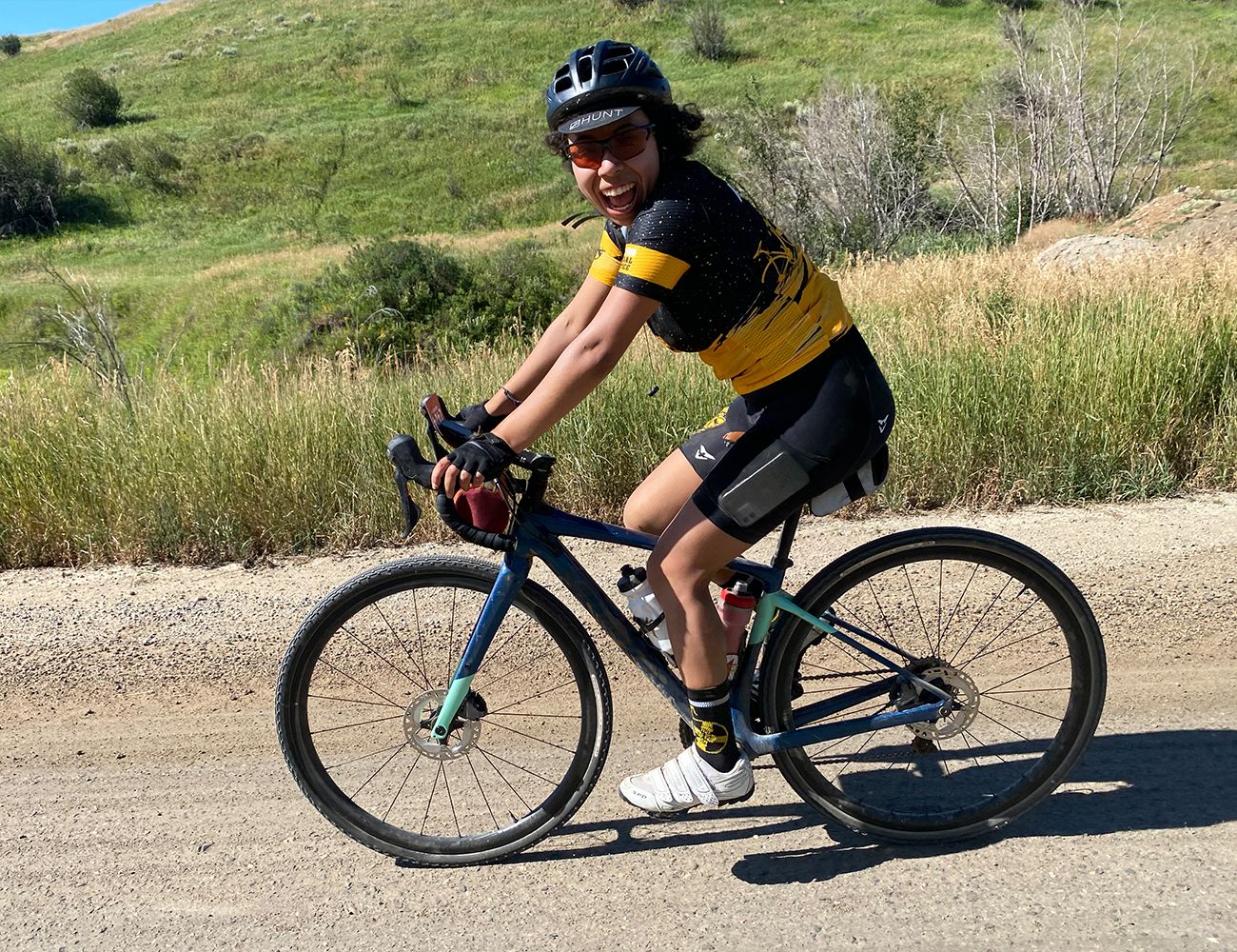 woman riding gravel bike race