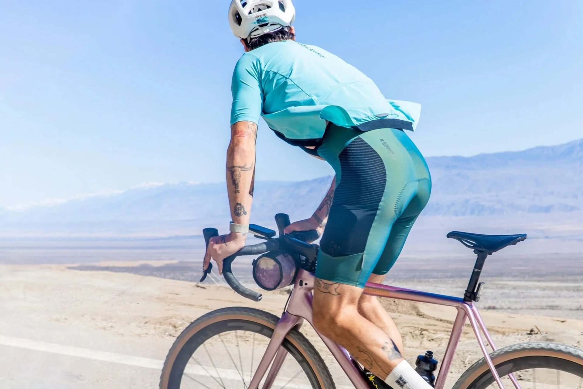 man riding a bike wearing cycling bibs