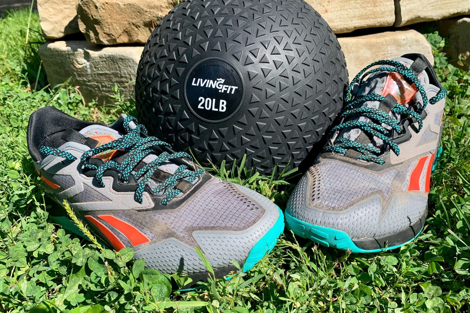 reebok nano x2 adventure shoes sitting in grass with an exercise ball
