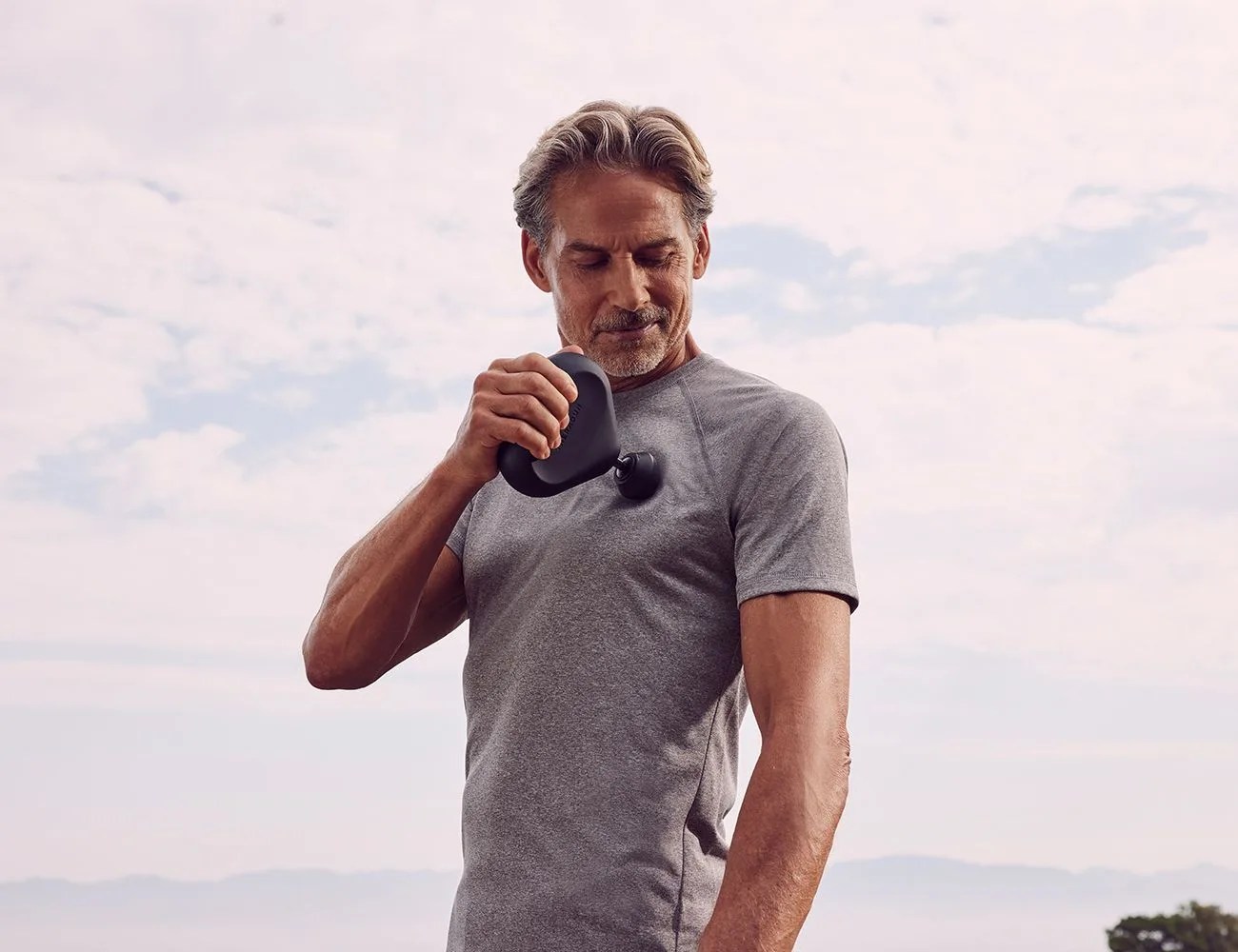 man using a therabody tool