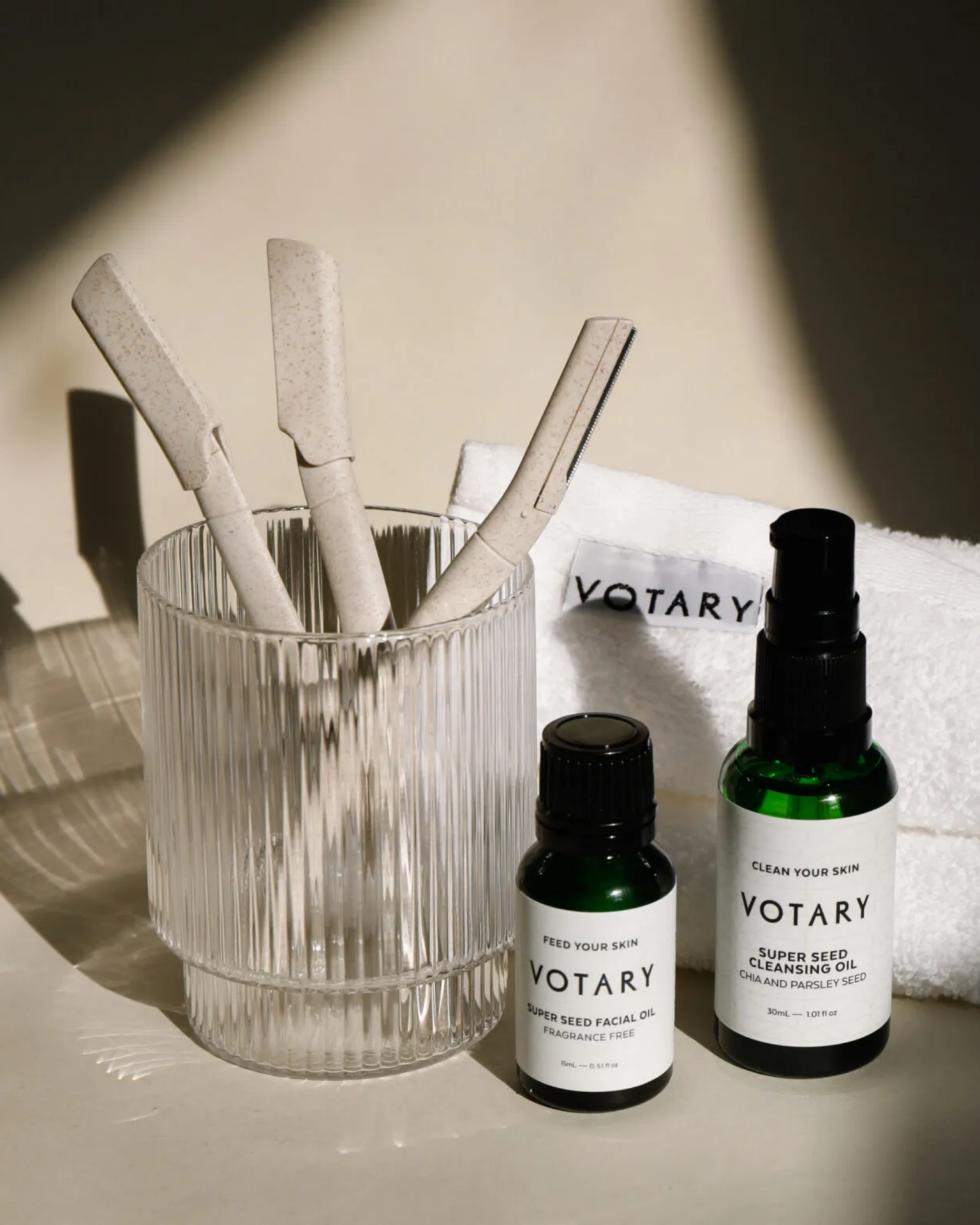 votary skincare products placed in a bathroom setting