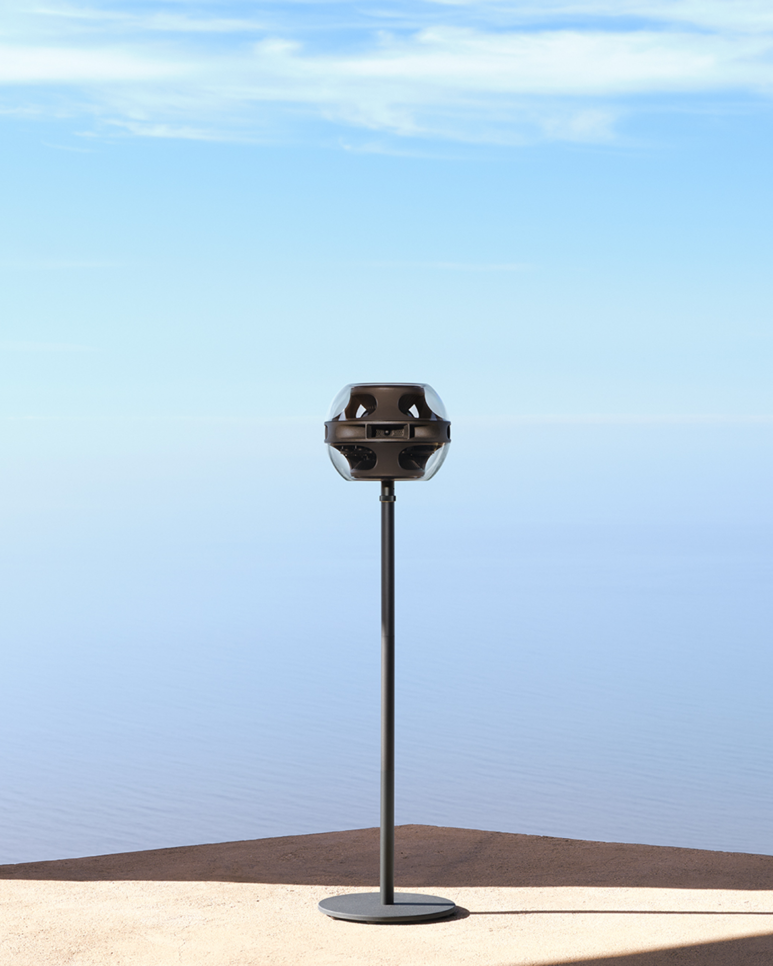 a syng cell alpha with floor stand in black