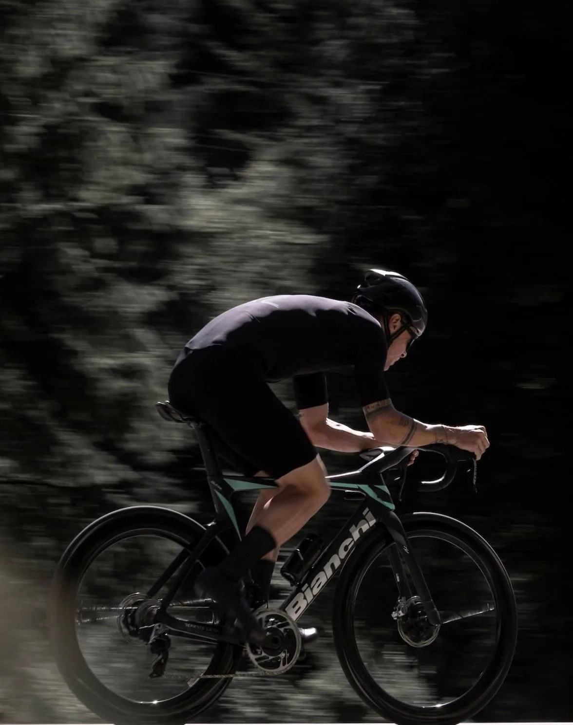 man riding bianchi oltre rc bike on road