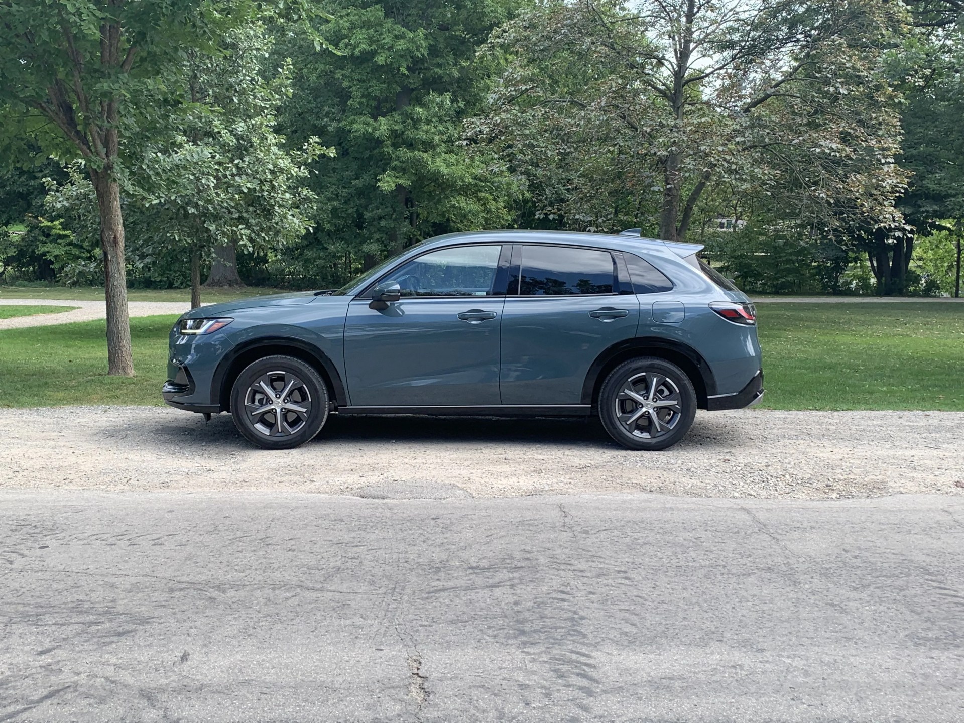honda hr v parked next to a park