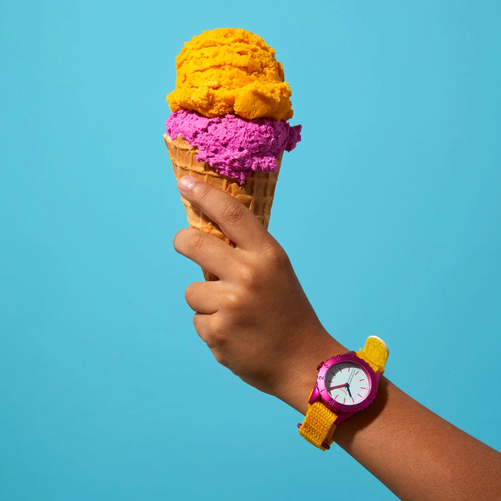 kid holding ice cream cone wearing a parchie watch