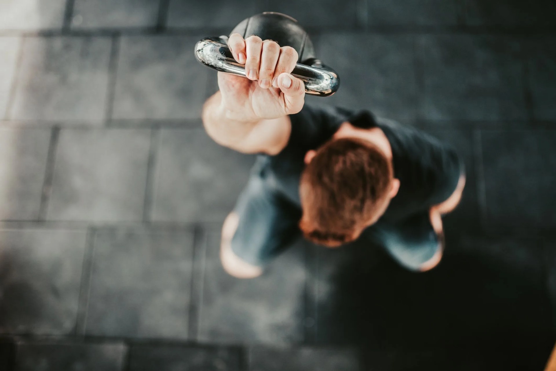 personal trainer working with kettlebell after quarantine
