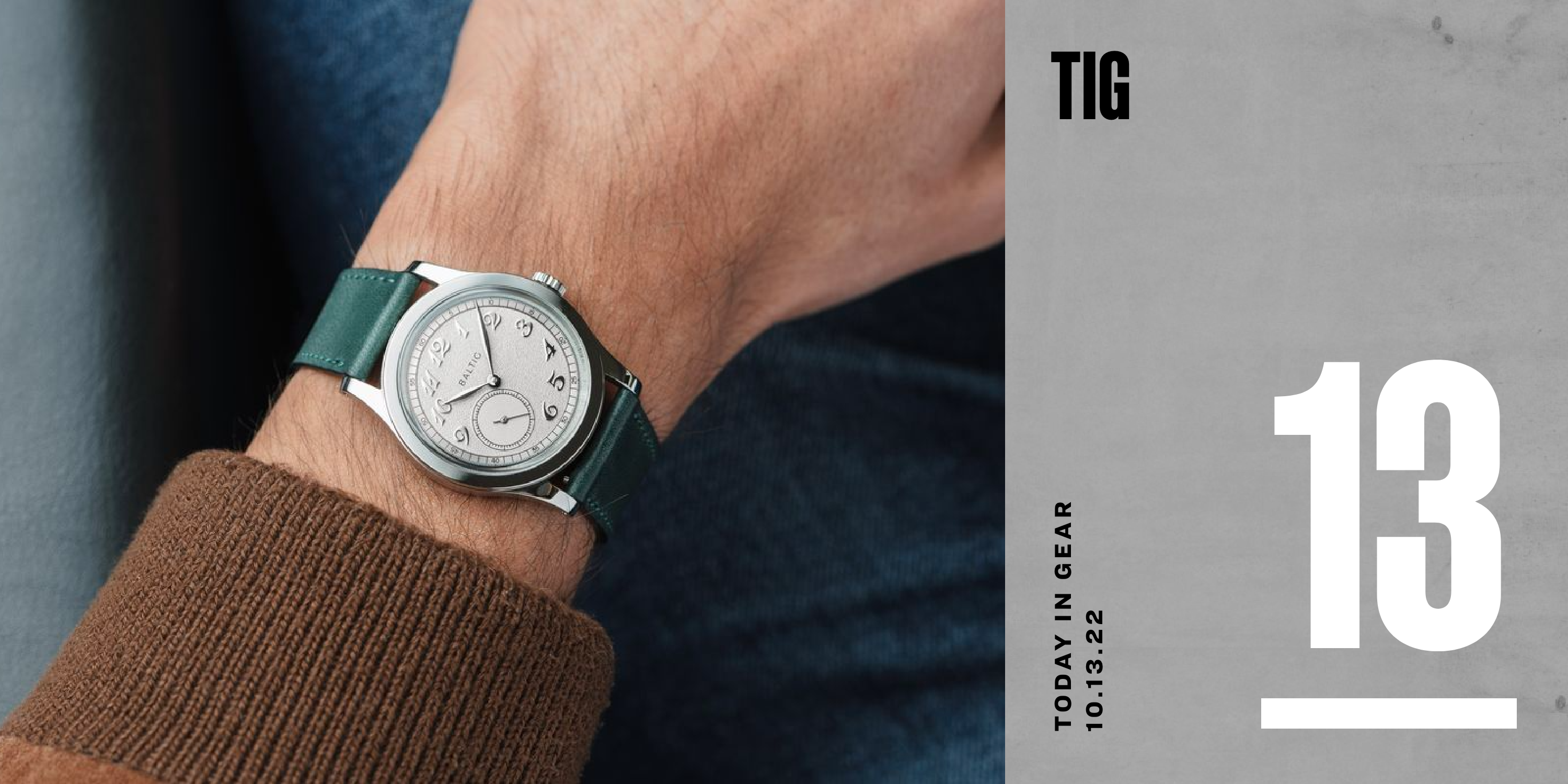 a baltic watch on wrist with a green strap