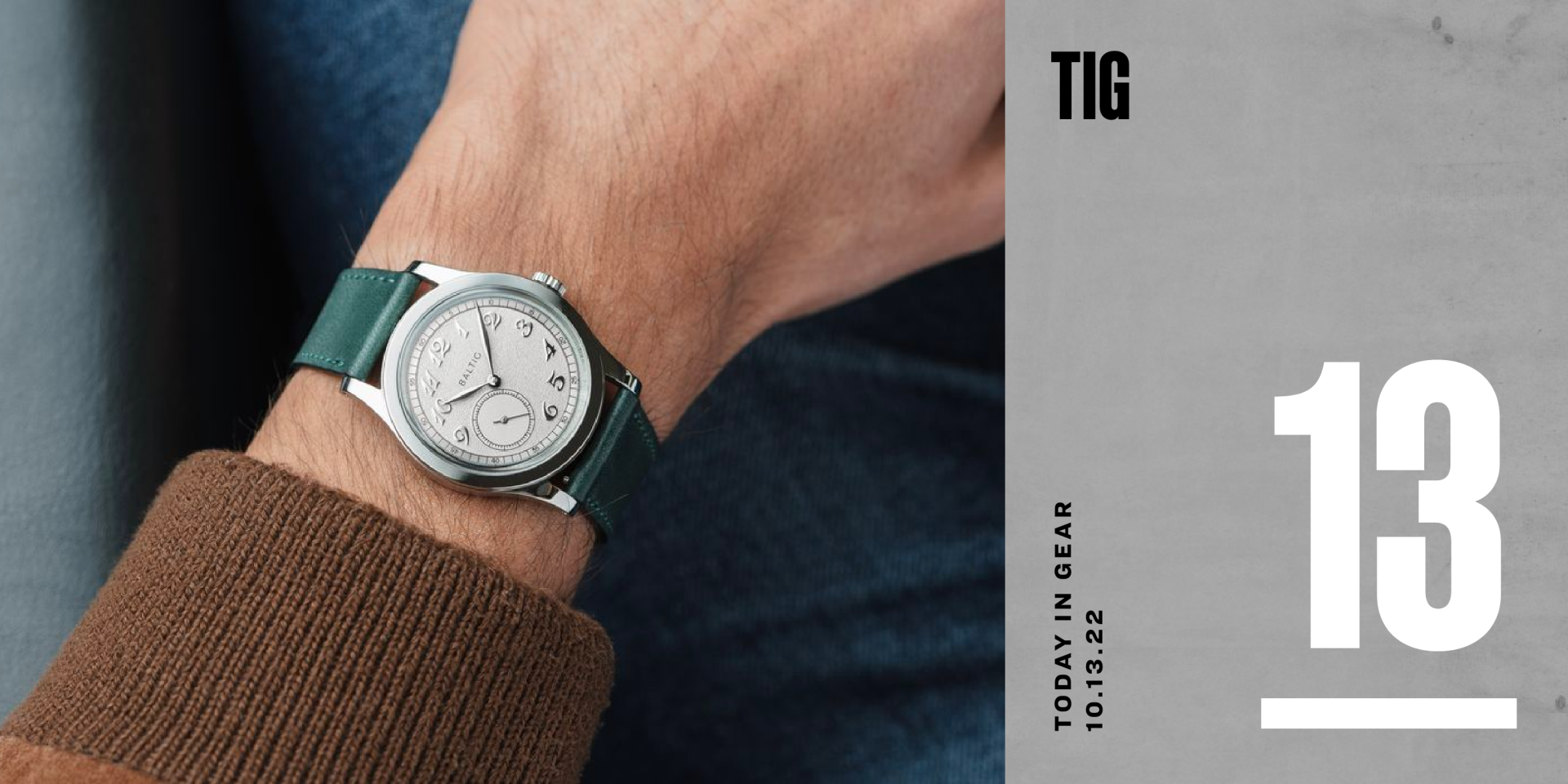 a baltic watch on wrist with a green strap