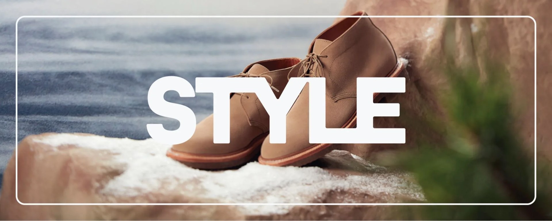 brown shoes on snowy rocks