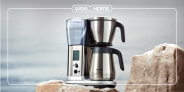 breville coffee maker sitting on rocks with a wga home logo