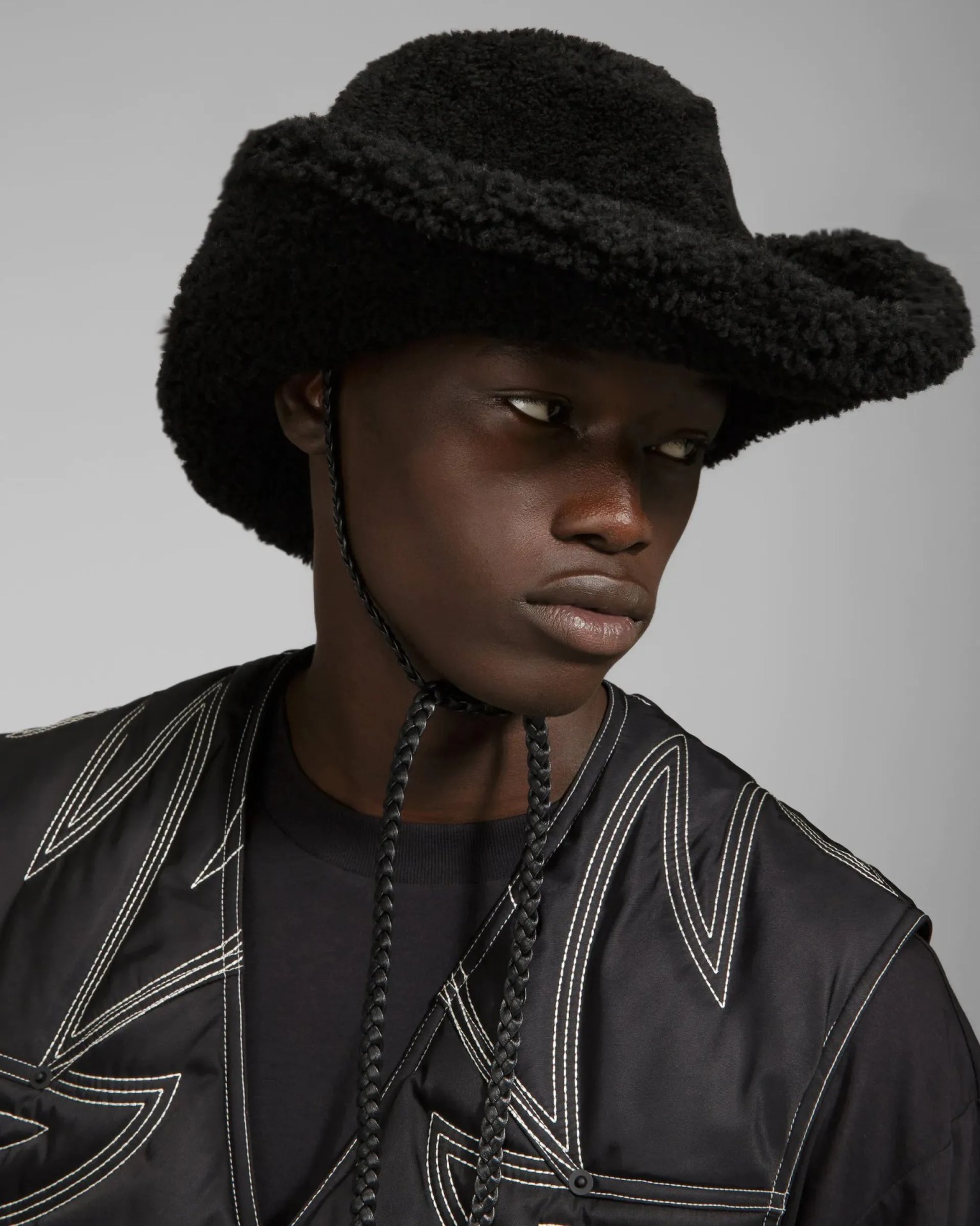 man wearing bally shearling hat shearling hat in black