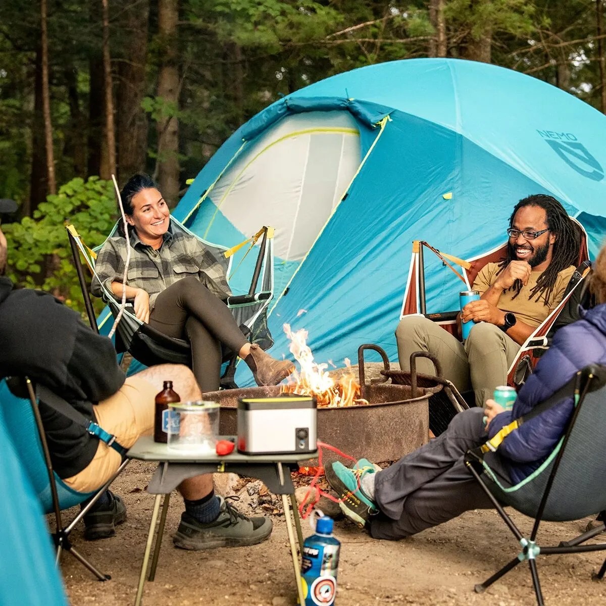 a group of people camping using backcountry nemo equipment stargaze luxury recliner camp chair