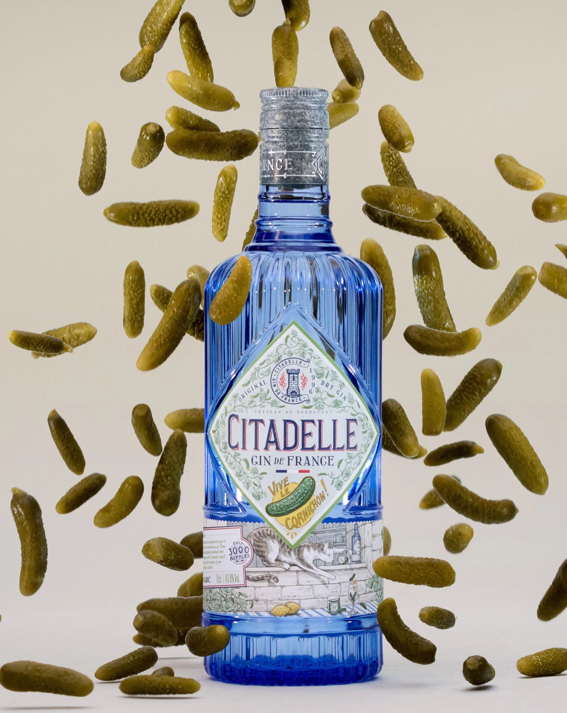 citadelle original gin with pickles falling in the background