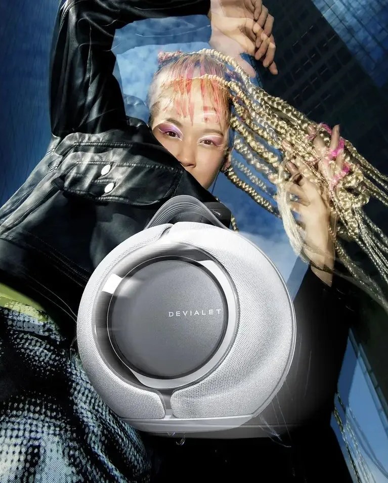 woman dancing behind devialet mania speaker