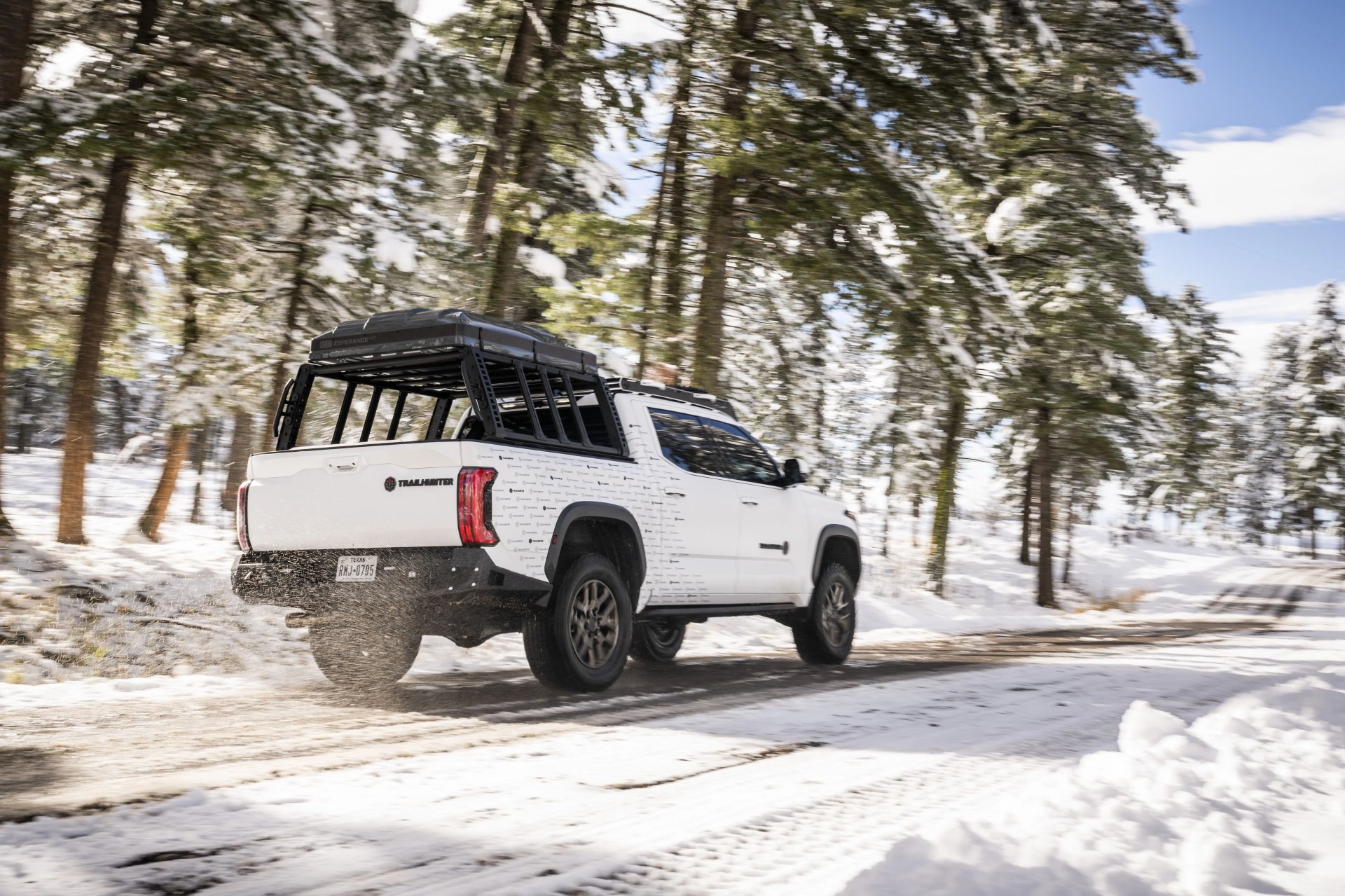 toyota tundra trailhunter concept from the rear driving on a snowy road