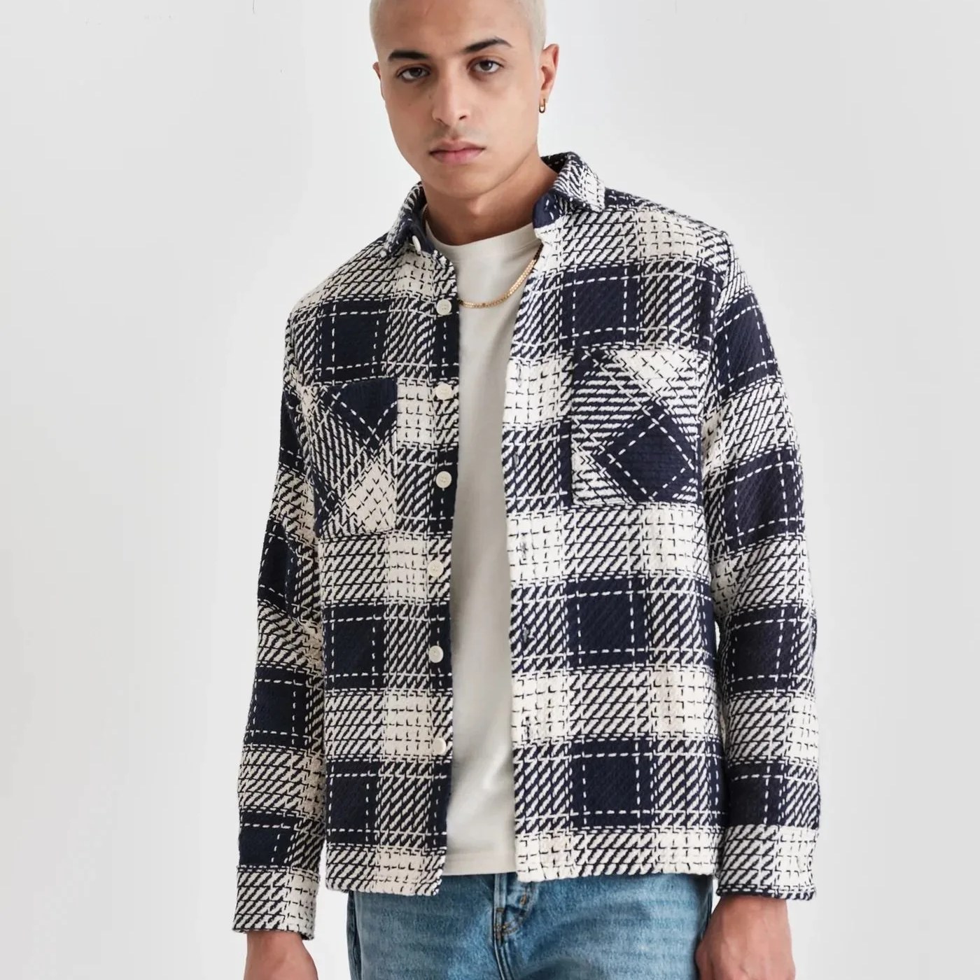 a man wearing a flannel shirt
