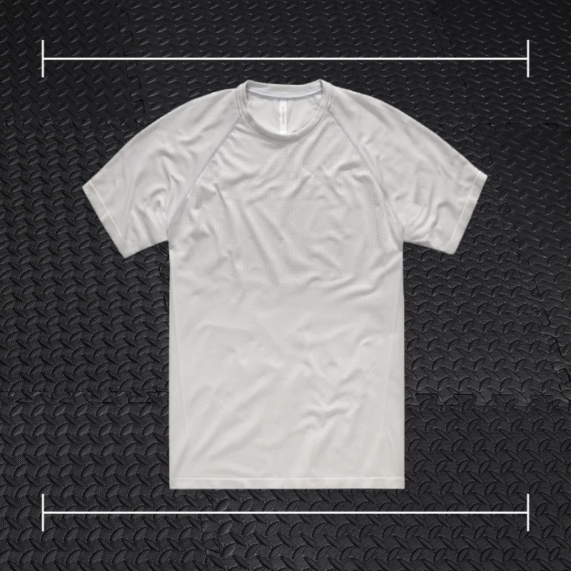 a grey ten thousand short sleeve shirt laid on top of a photo of black rubber gym flooring
