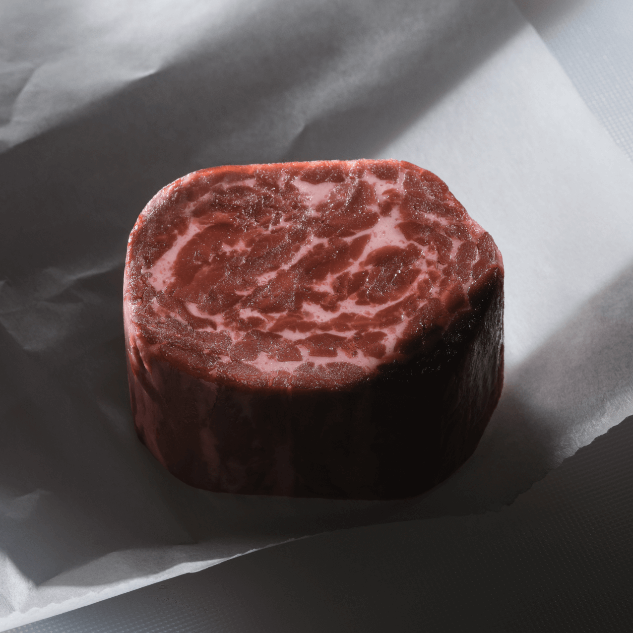 juicy marbles meat round on parchment paper