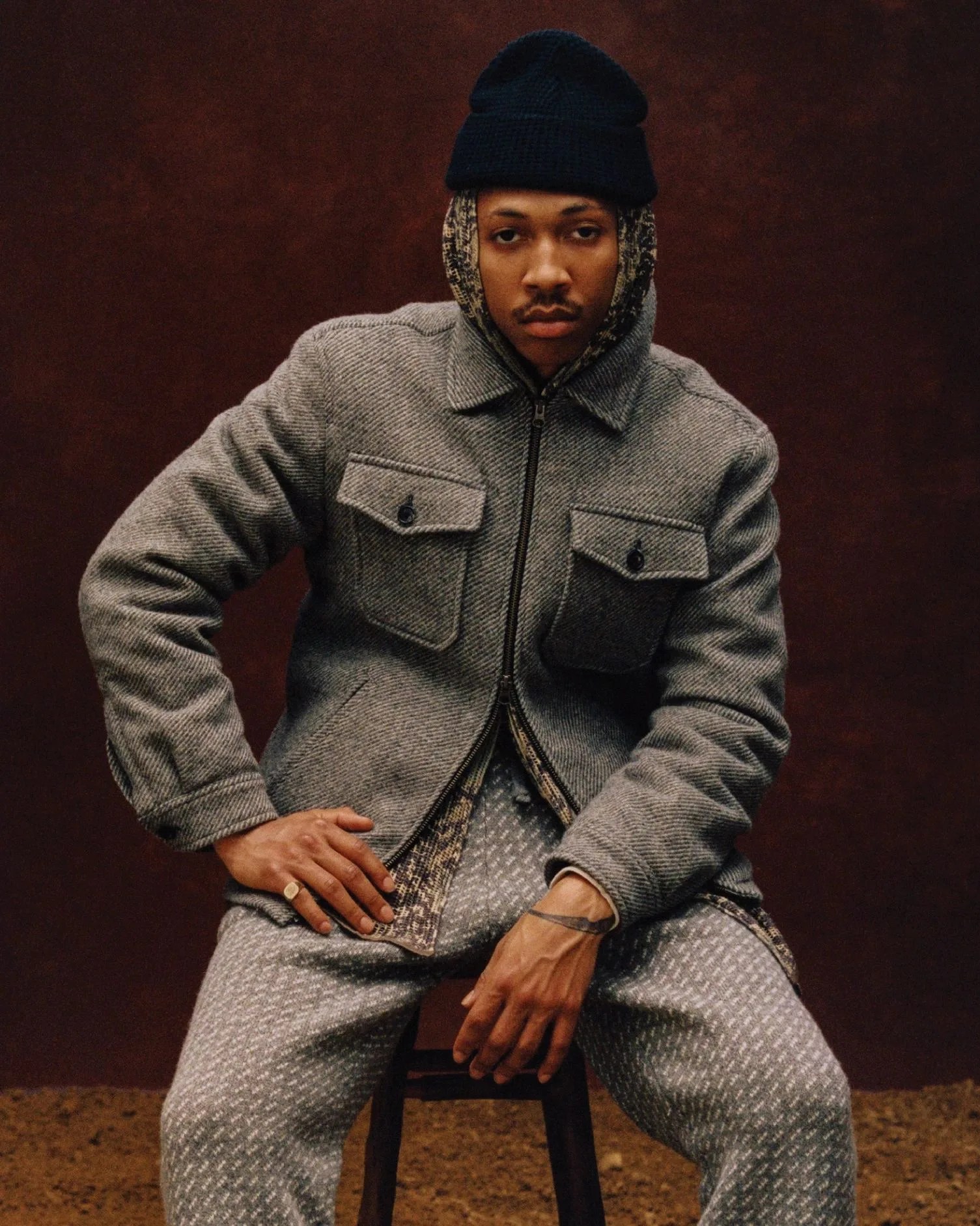 man wearing aimé leon dore x woolrich collection