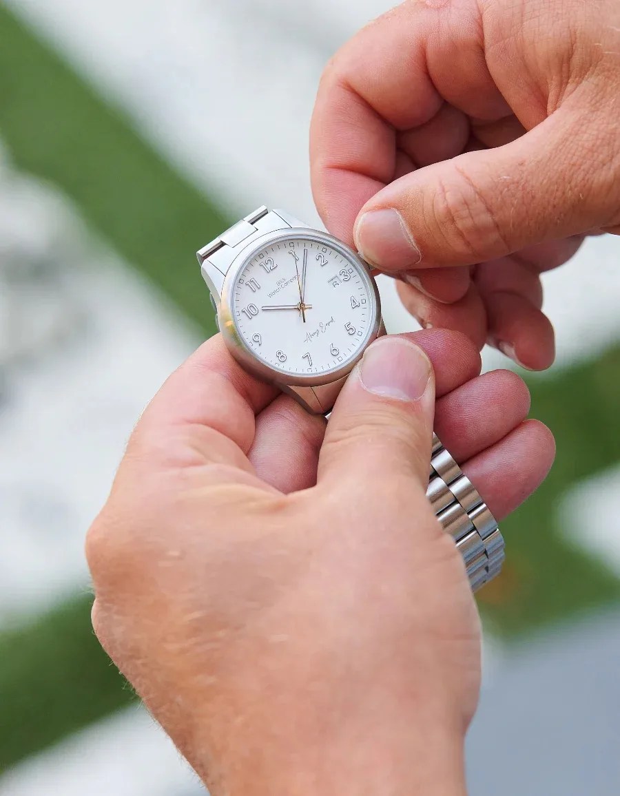 man winding a brick watch
