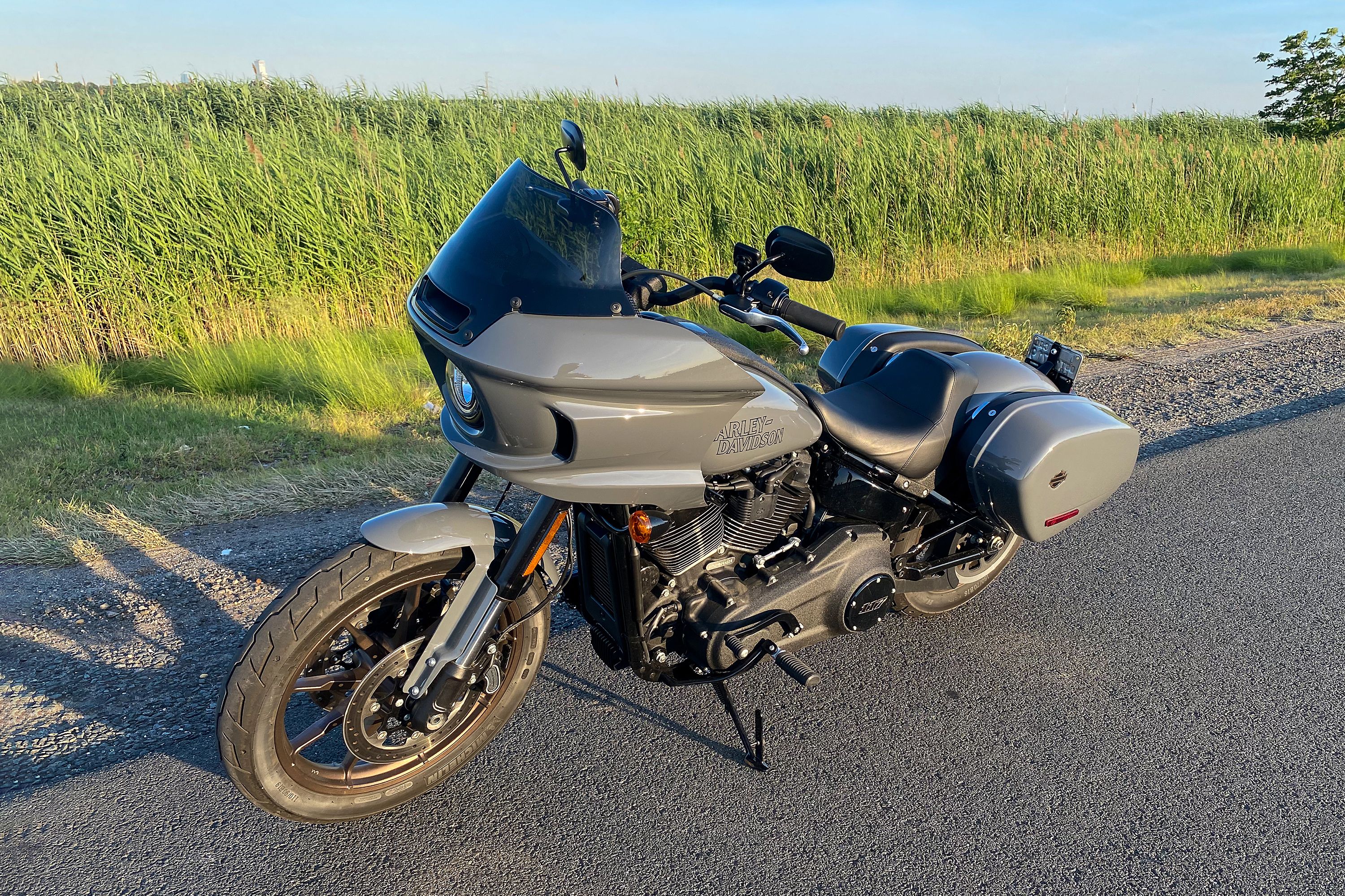 harley low rider st motorcycle parked on side of road