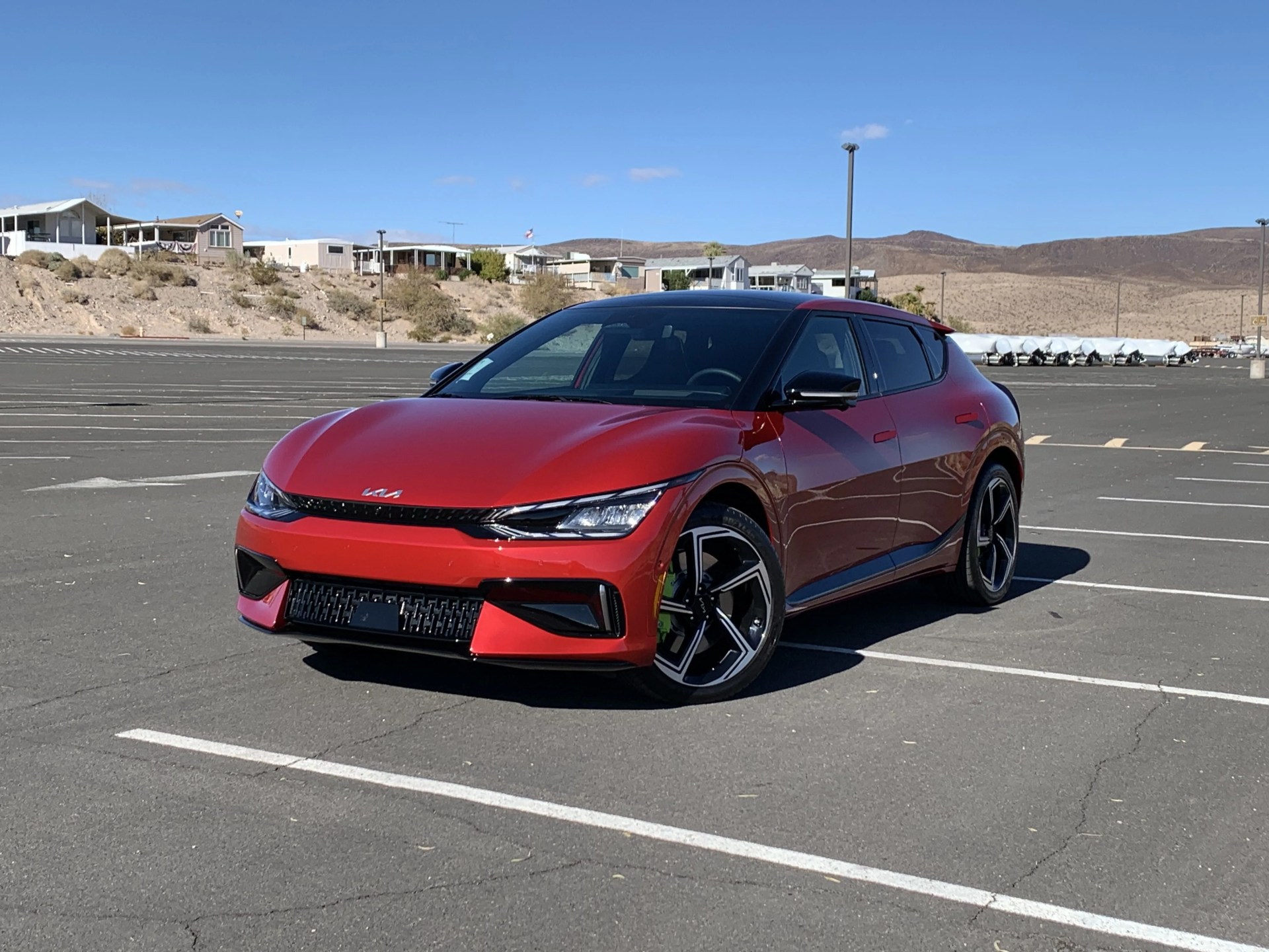 kia ev6 gt in a parking lot with nevada desert in background