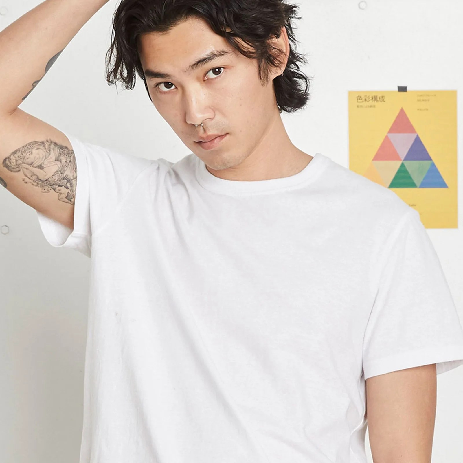 man wearing entireworld white tee