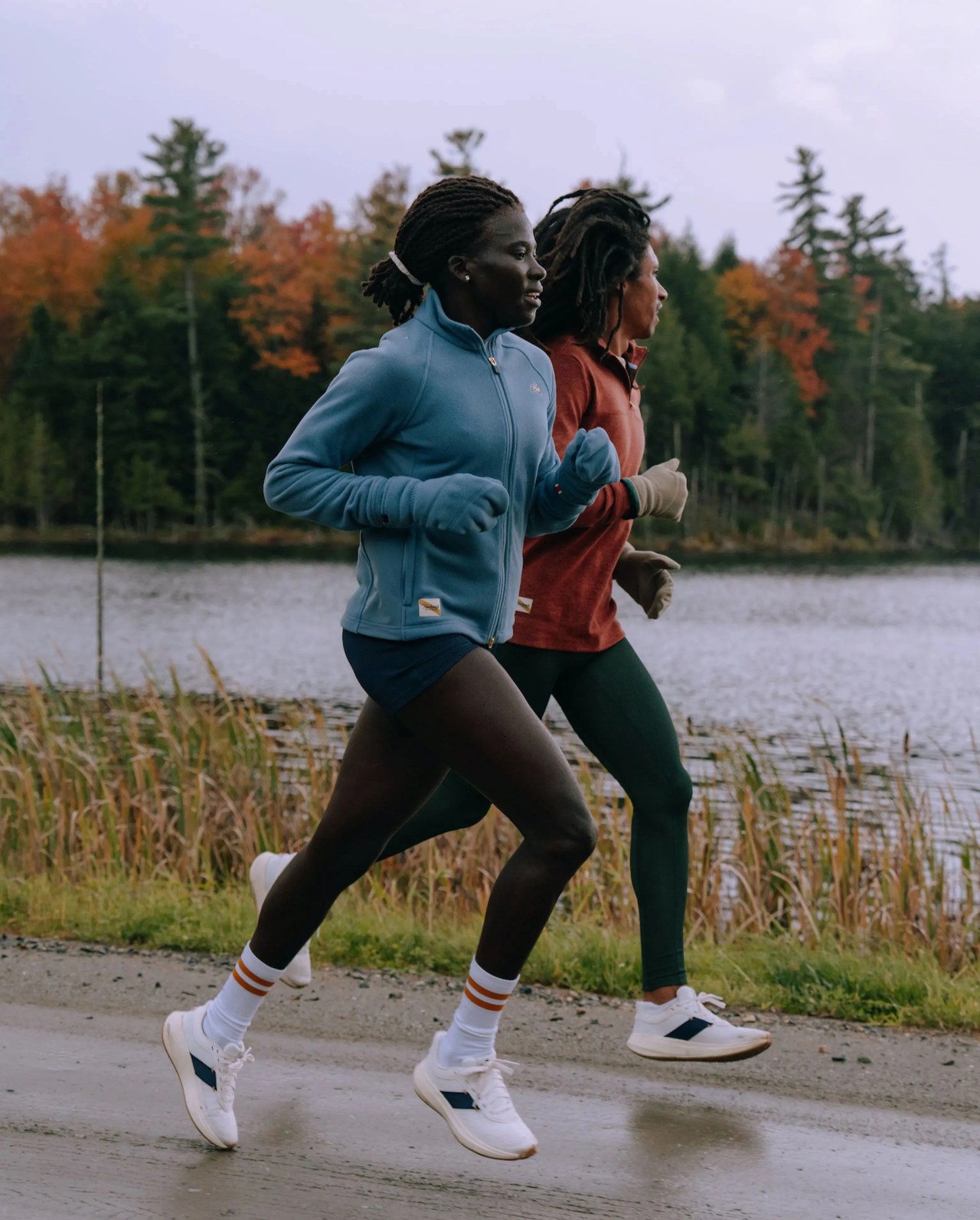 people wearing tracksmith eliot runner sneaker while jogging