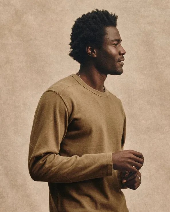 man wearing buck mason field spec rugby crew in dusty copper