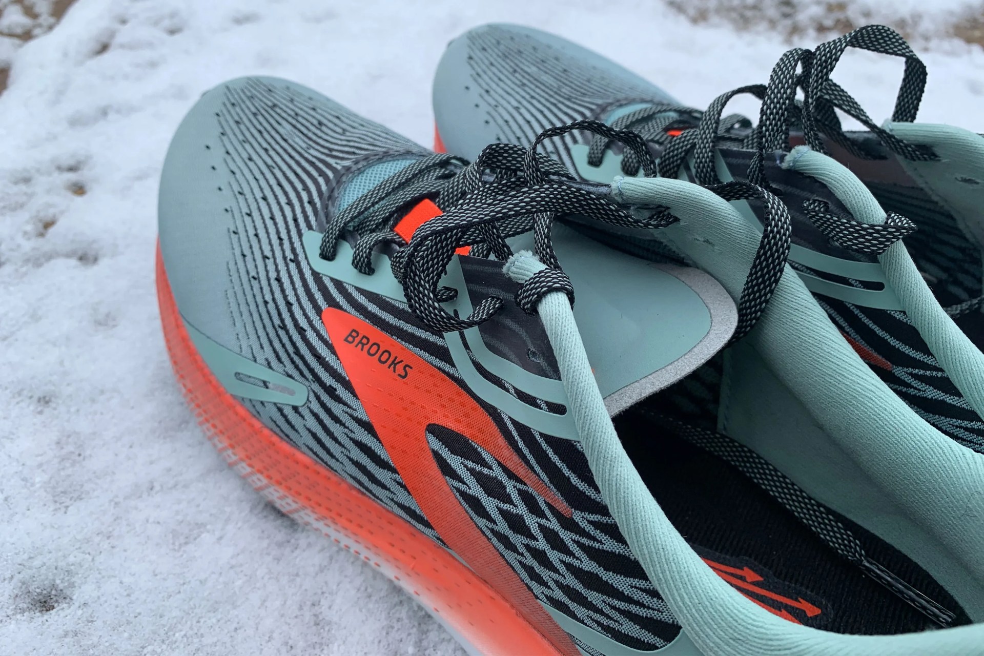 brooks hyperion max shoes on a snowy sidewalk