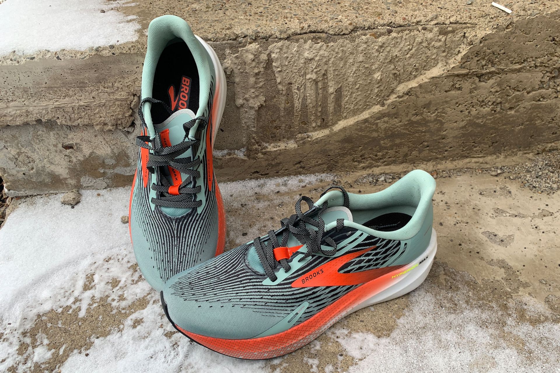 brooks hyperion max shoes on a snowy sidewalk