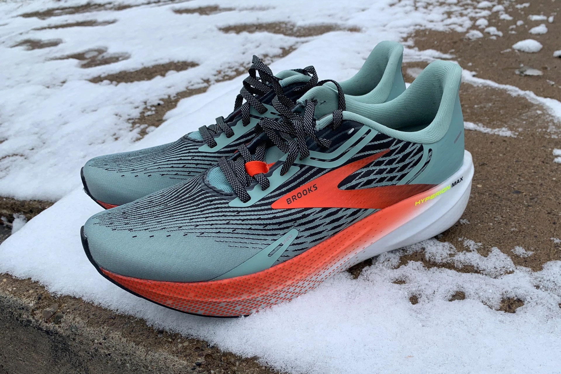 brooks hyperion max shoes on a snowy sidewalk