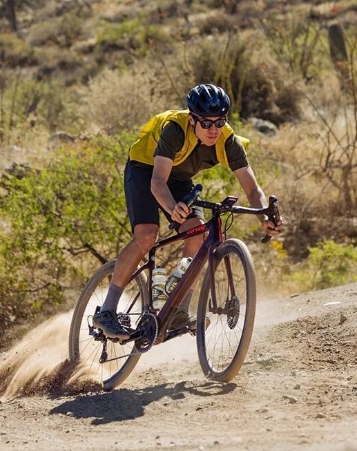 man biking wearing giro aries spherical helmet