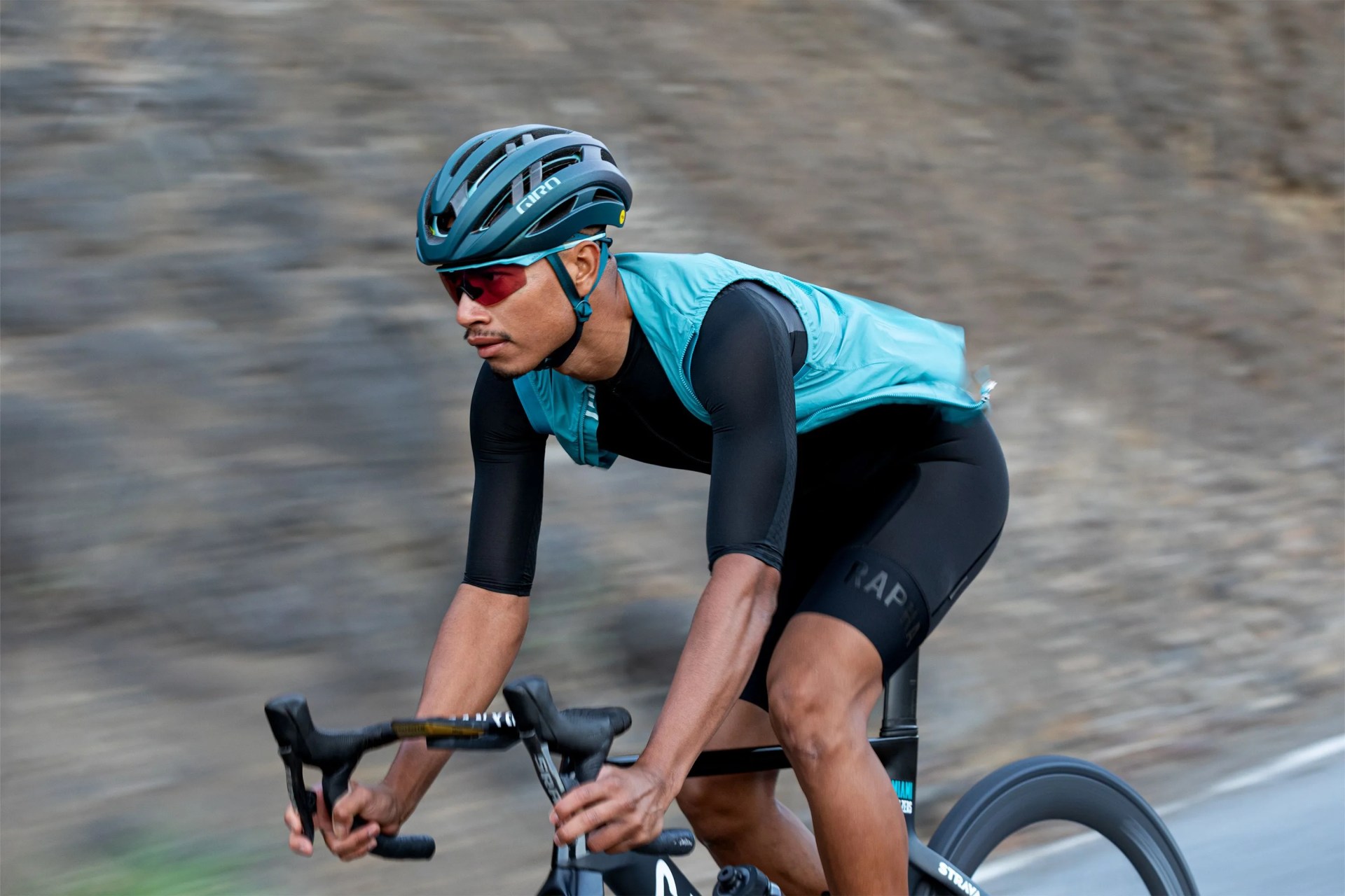 man riding a bike wearing a giro bike helmet