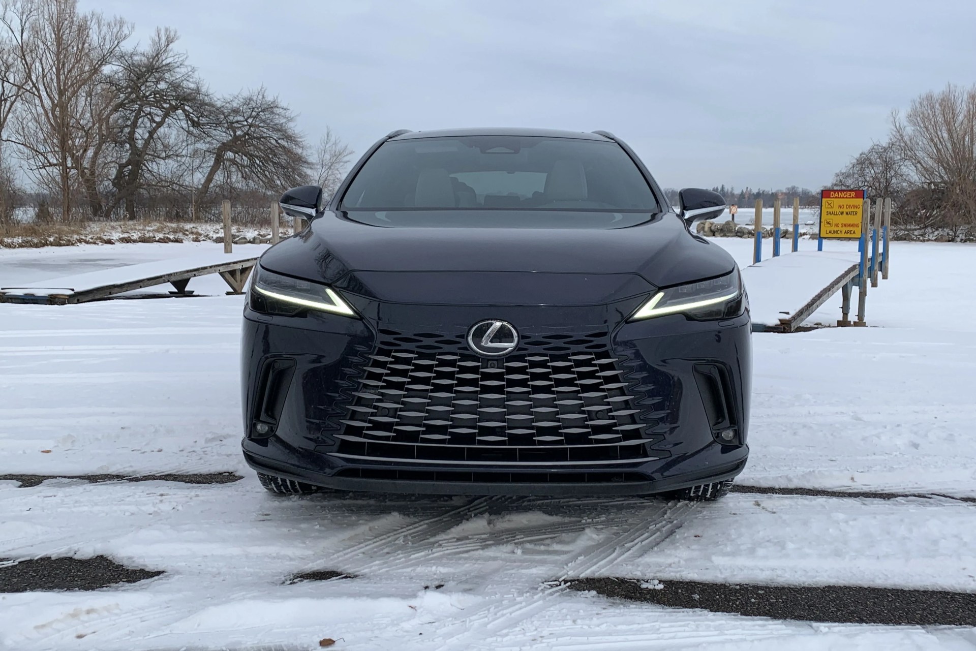 lexus rx 350h from the front by a snowy boat launch