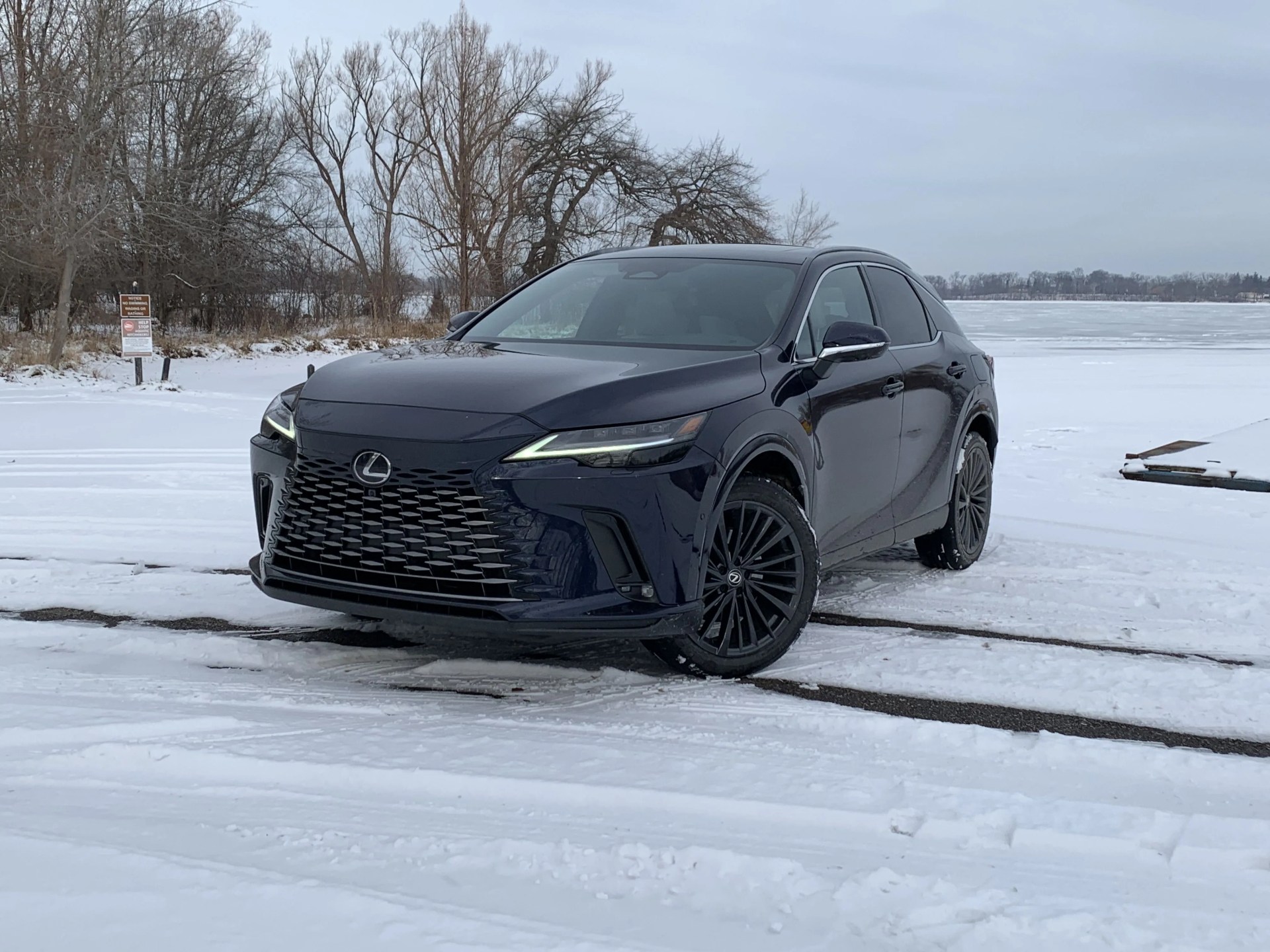 lexus rx parked next to a snowy boat launch