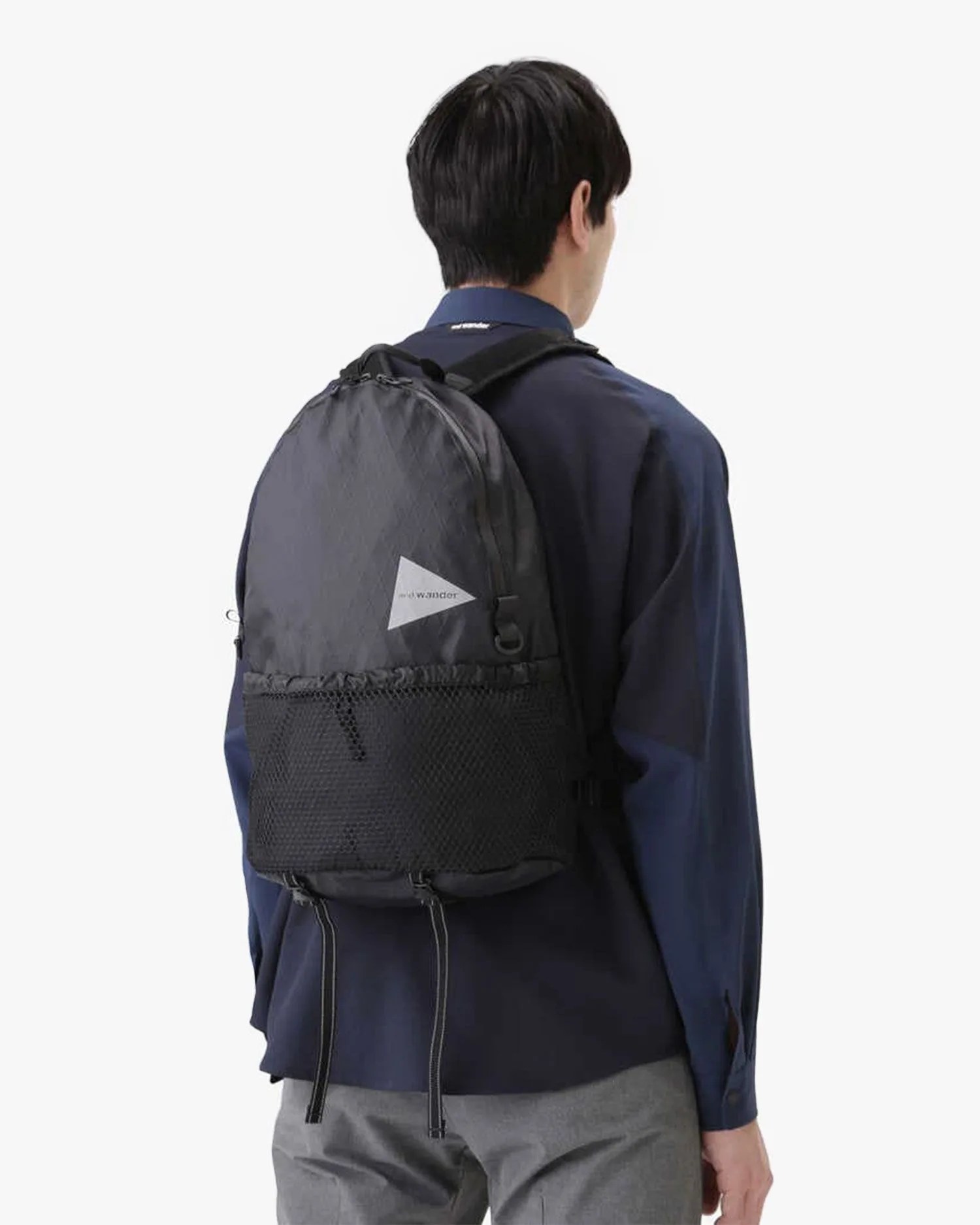 man wearing and wander x pac 20l daypack