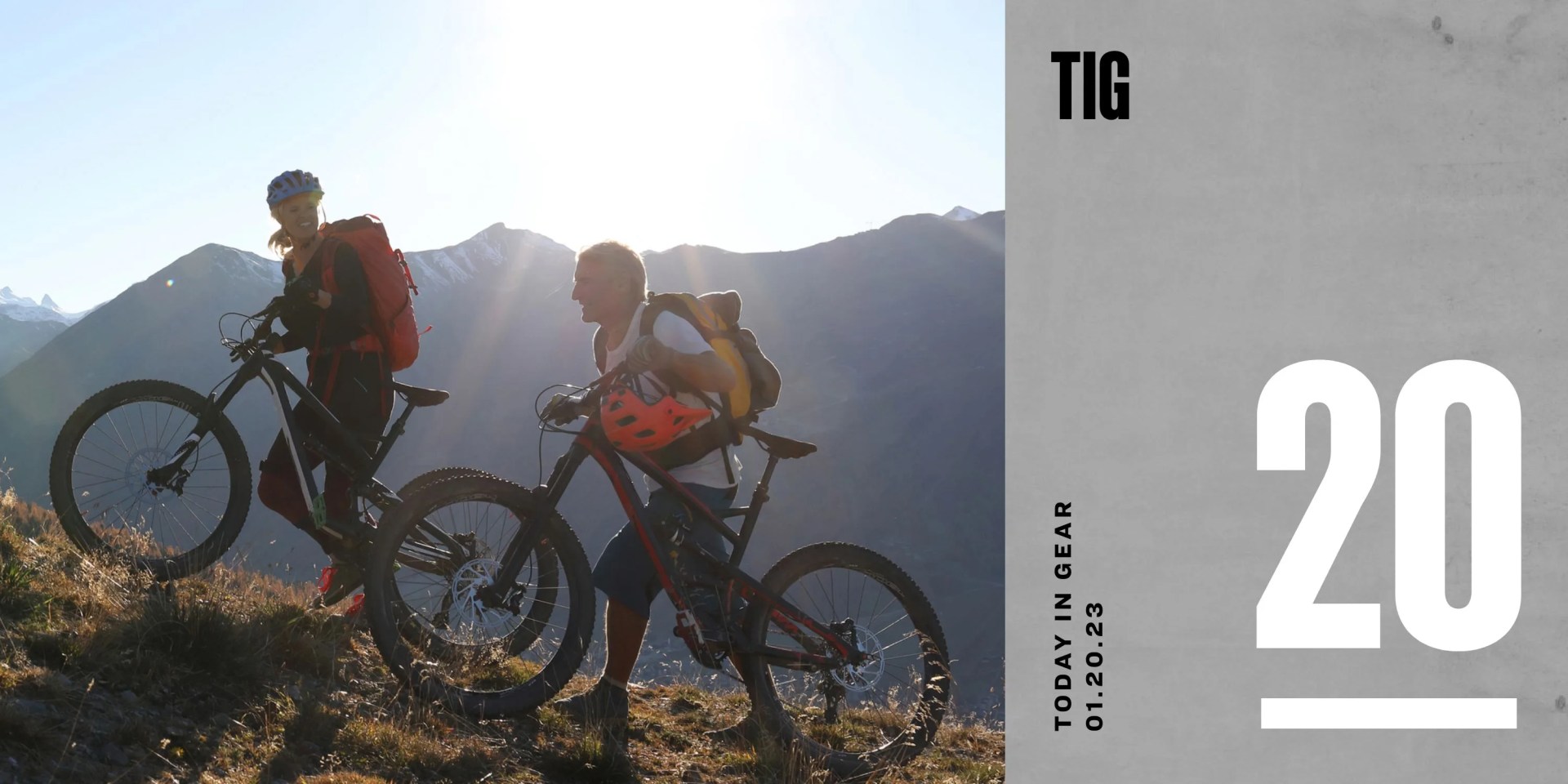 today in gear january 20 2023 world nomad insurance covers two bikers walking their bikes up a grassy hill