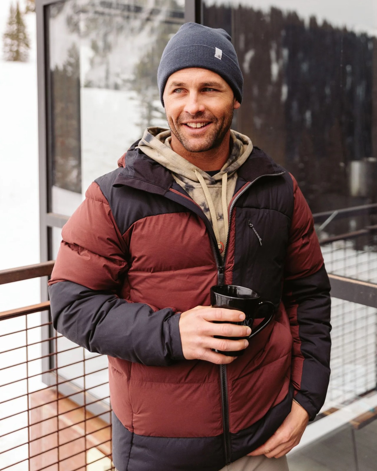 man wearing artilect's high af down stretch parka